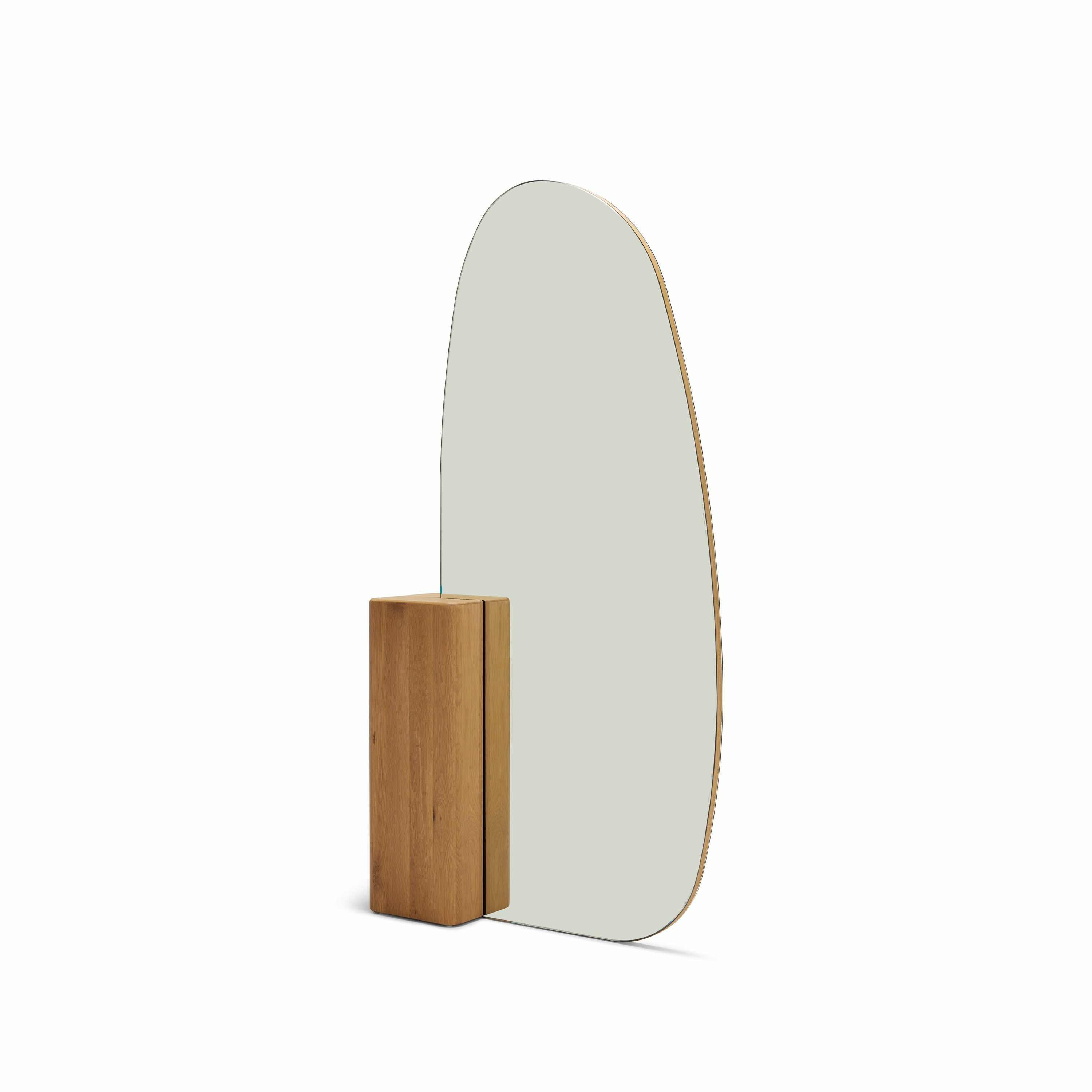 A Block Floor Mirror in Oak viewed from an angle.