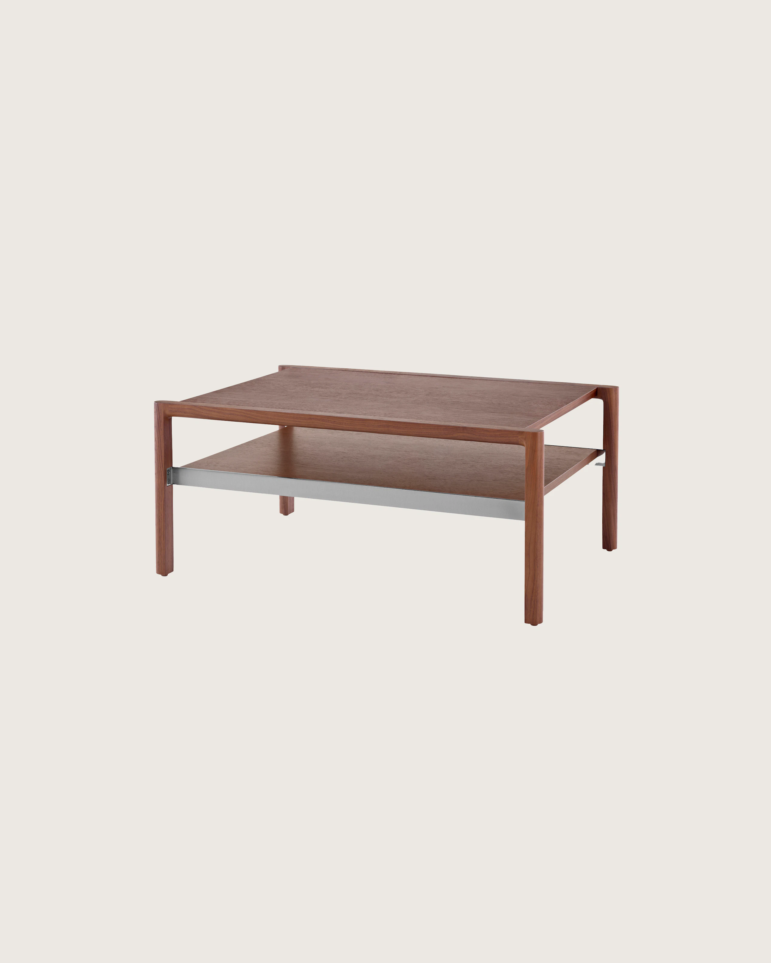 A Brabo side table with a walnut top and lower shelf, viewed at an angle.