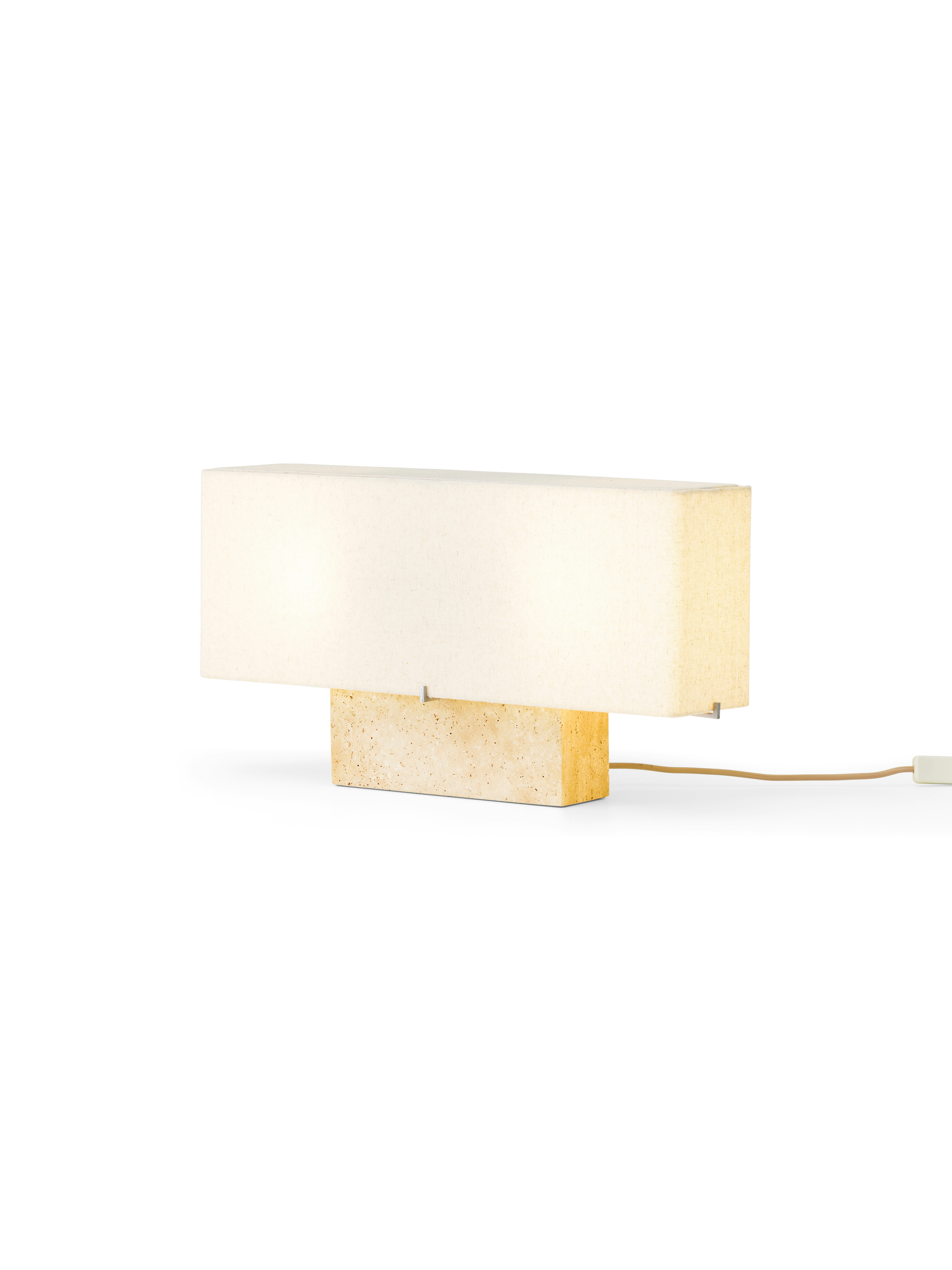 A Nonna Travertine Table Lamp  viewed from the front.