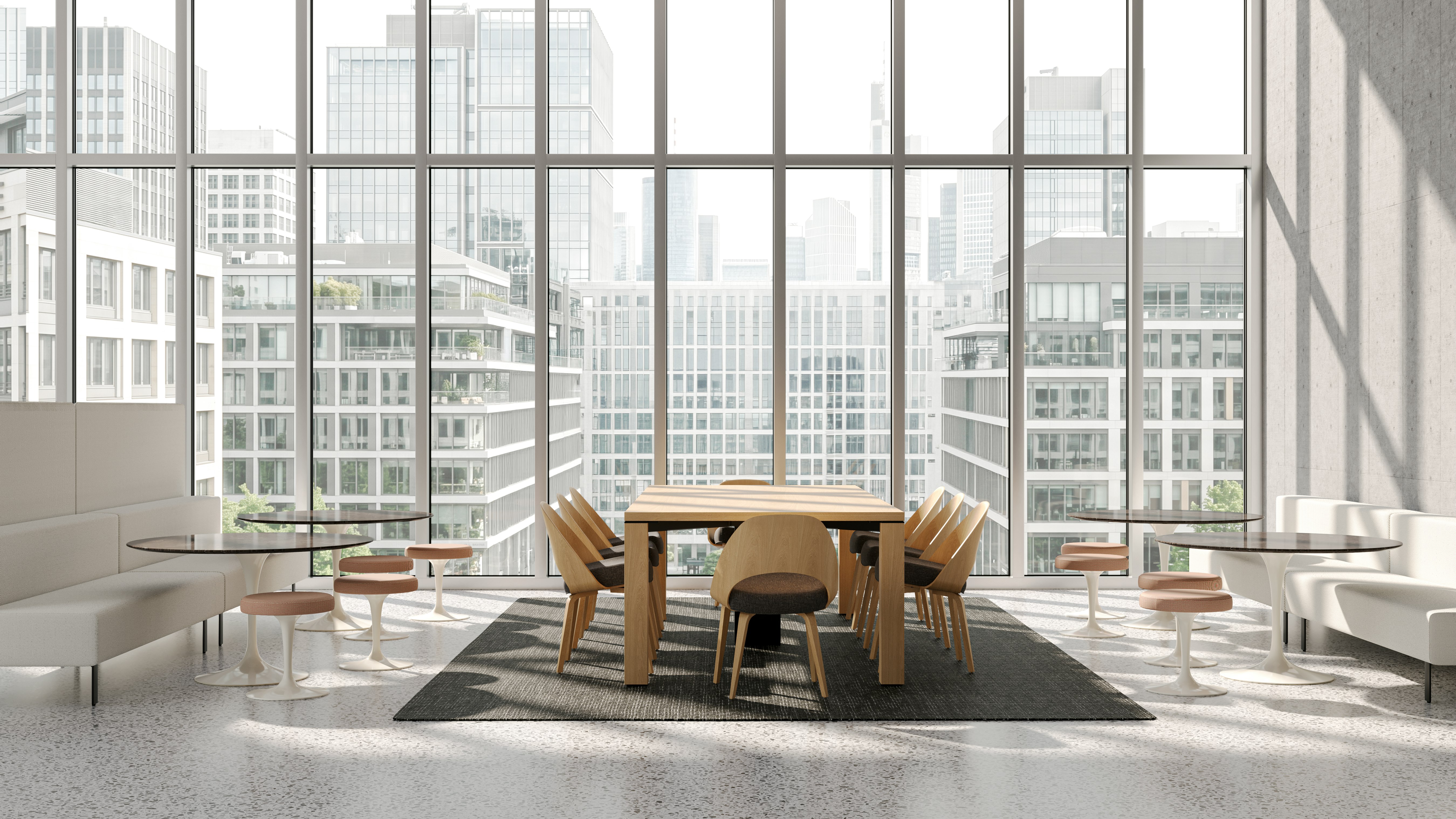 Brown Saarinen Executive Chairs with Reff Profiles Table and an assortment of Saarinen Tables and Tulip Stools.