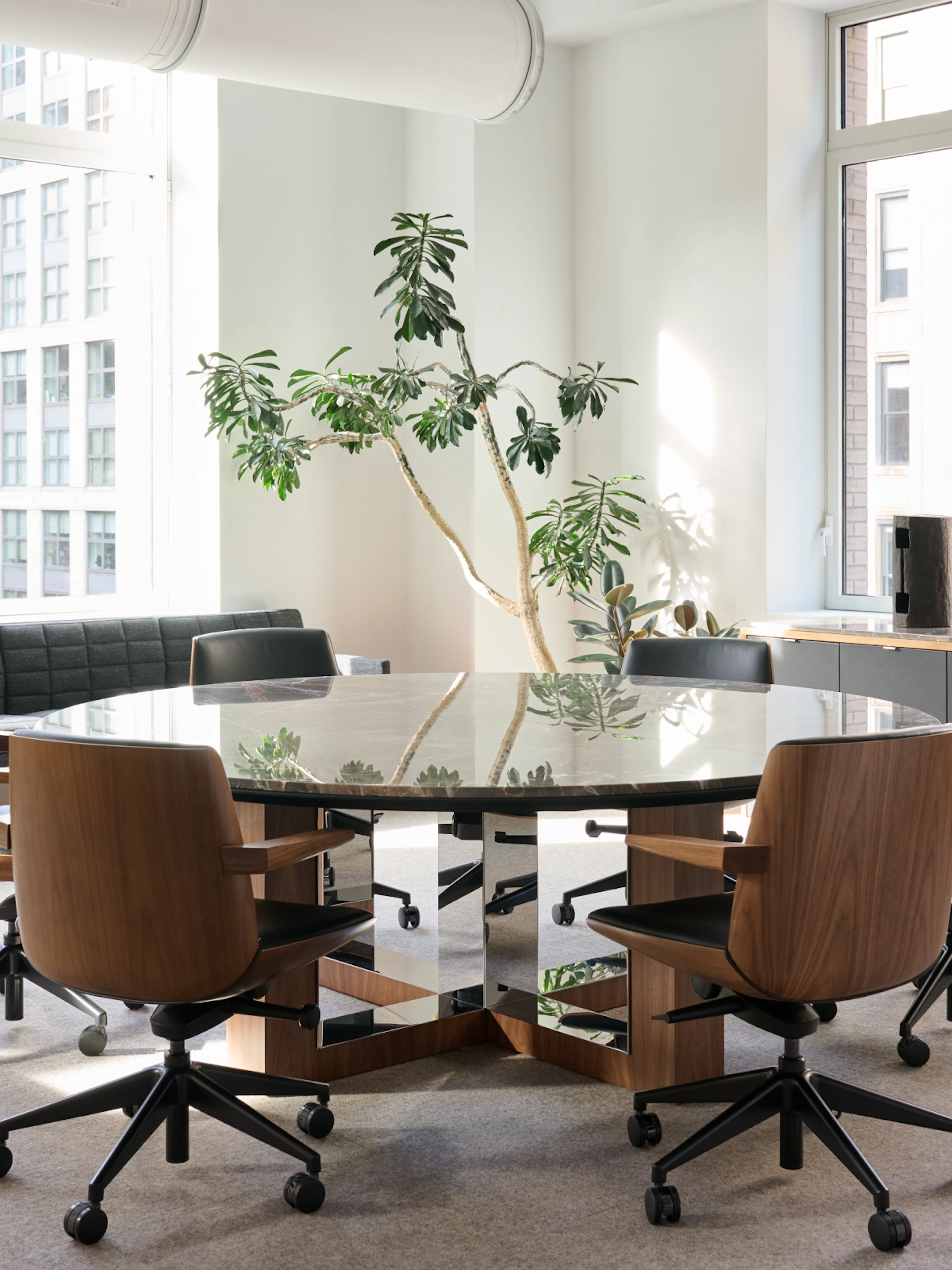Highline Fifty Meeting Table with Clamshell Chairs in a meeting room setting with Tuxedo Component Benching and a Highline Credenza.