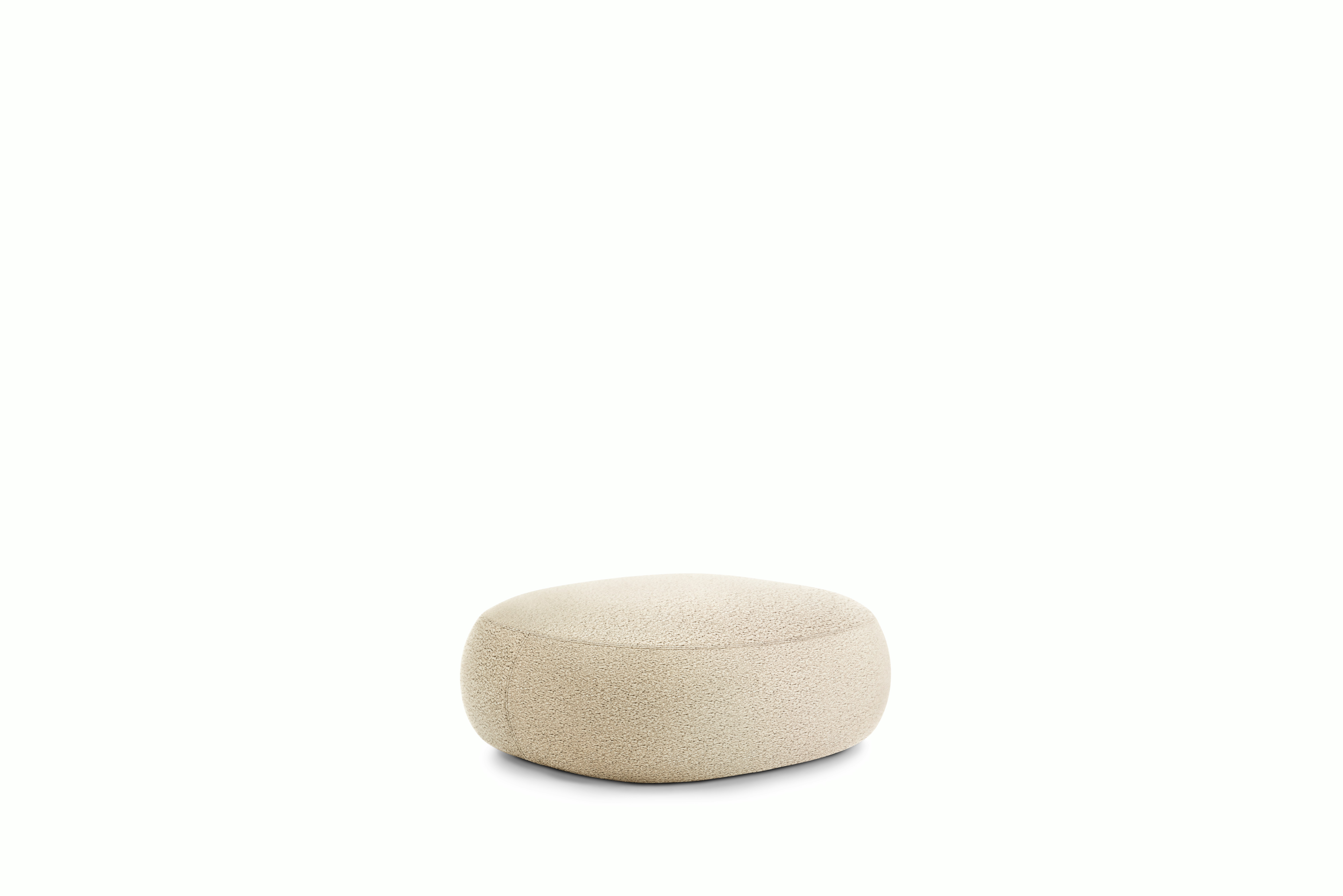 A Biboni Ottoman in Canvas viewed from an angle.
