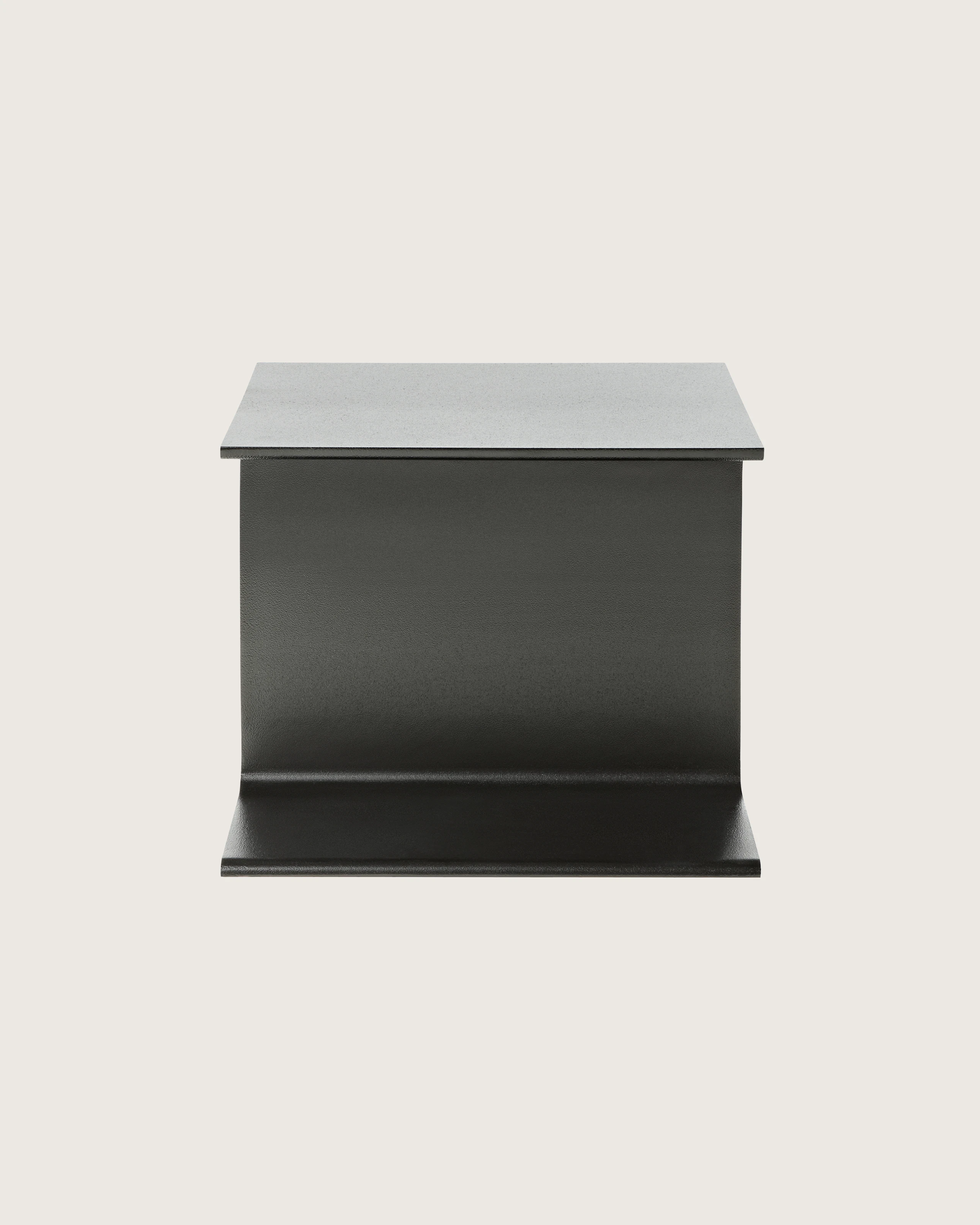 A black I Beam side table, oriented to display the cast-aluminum pedestal's central section.