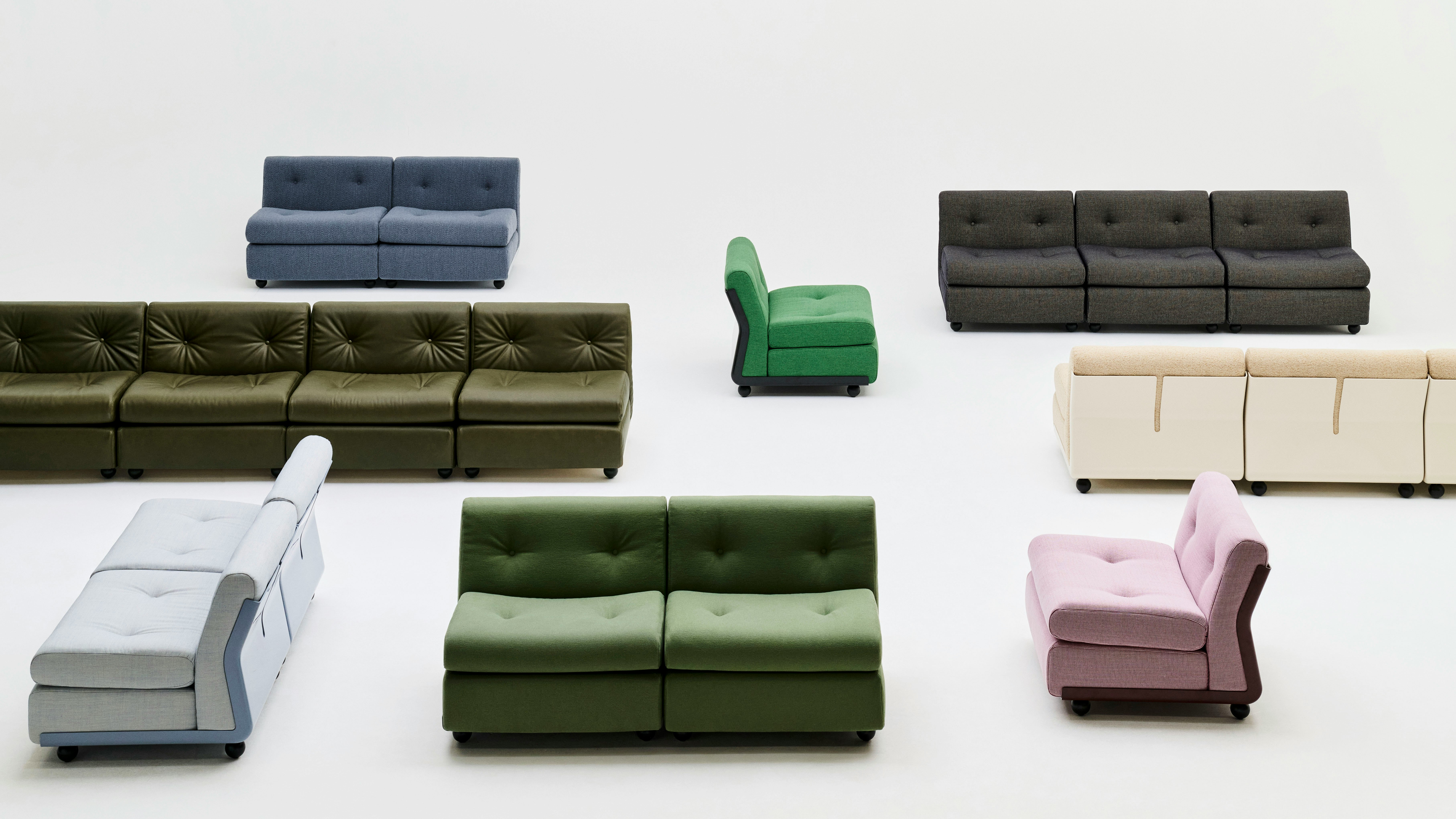 Top-down view of mixed Amanta modules in green, black, blue, pink, and gray, arranged in grid.