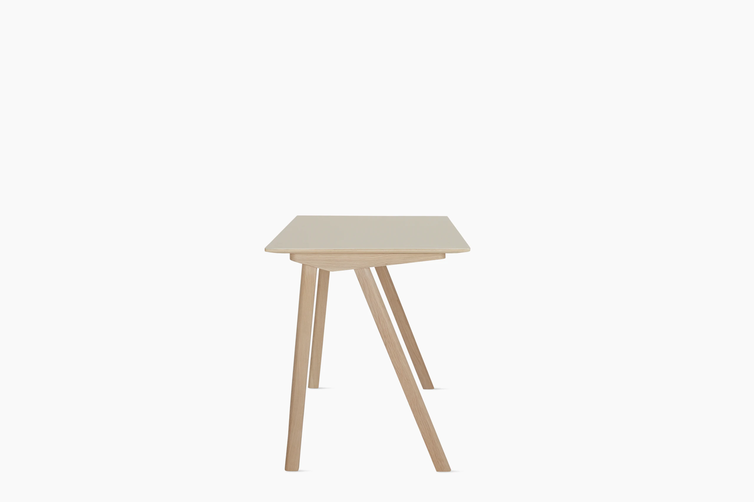An off white Copenhague 90 Desk viewed from the side