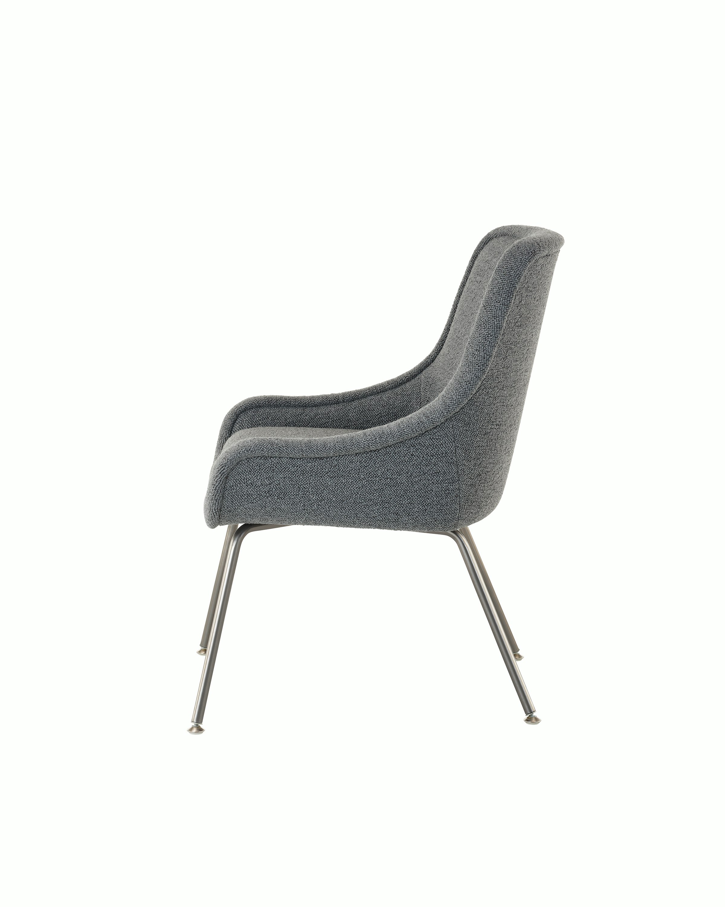 Bumper Armchair with low arms and four legged base, side view.