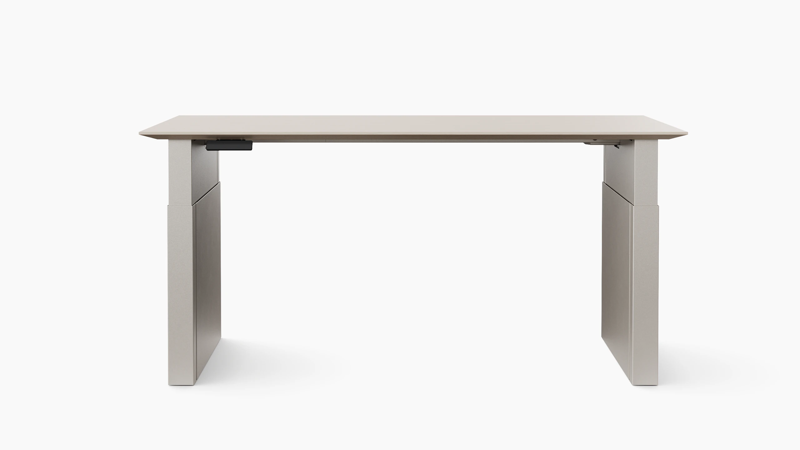 A height adjustable table with shrouded legs is shown in light finishes.