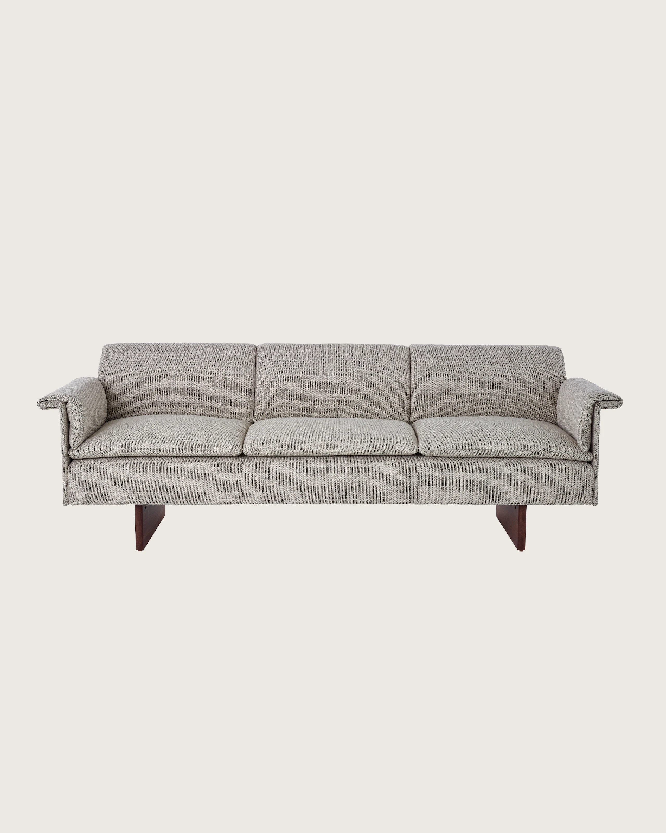 Mantle Three Seater Sofa in Capri Stone with Walnut Wood Base, viewed from the front.