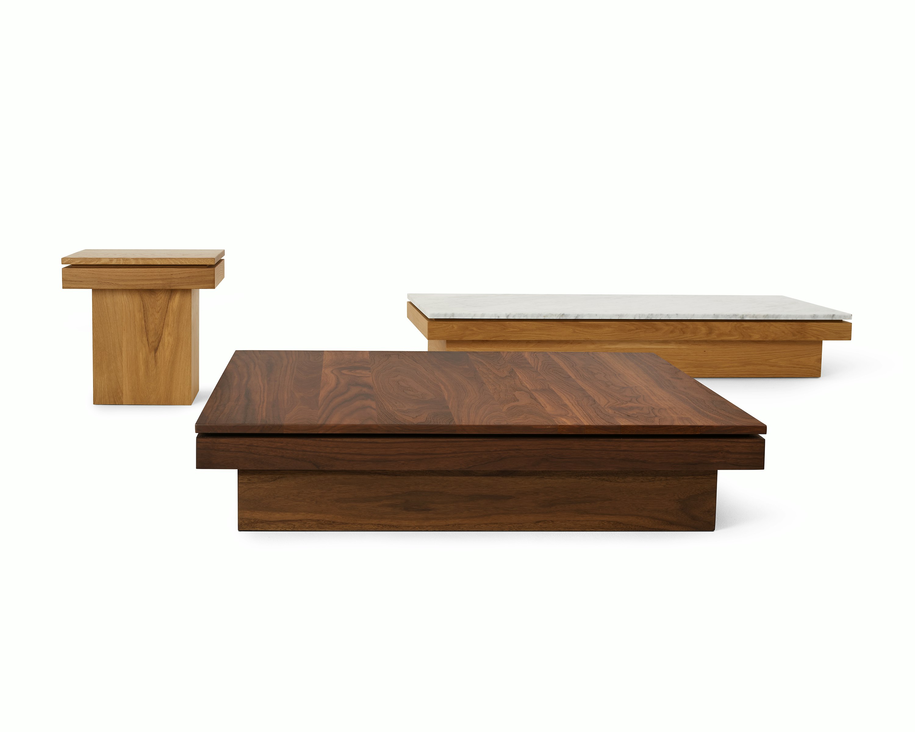 Three Pawson Drift side and coffee tables with walnut and oak wood finishes.