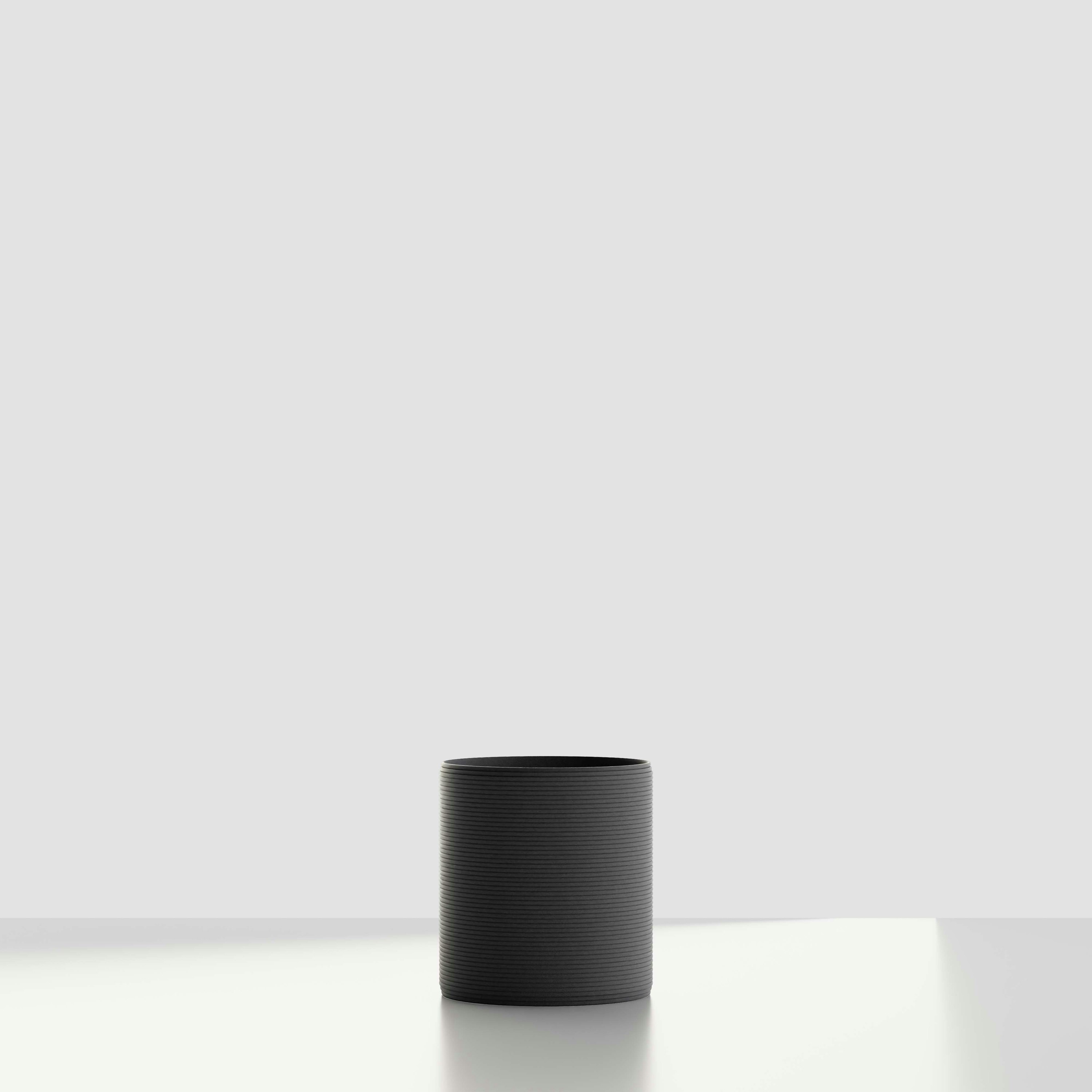 A Solana 3D Printed Concrete Planter in Obsidian Night Viewed from the front.