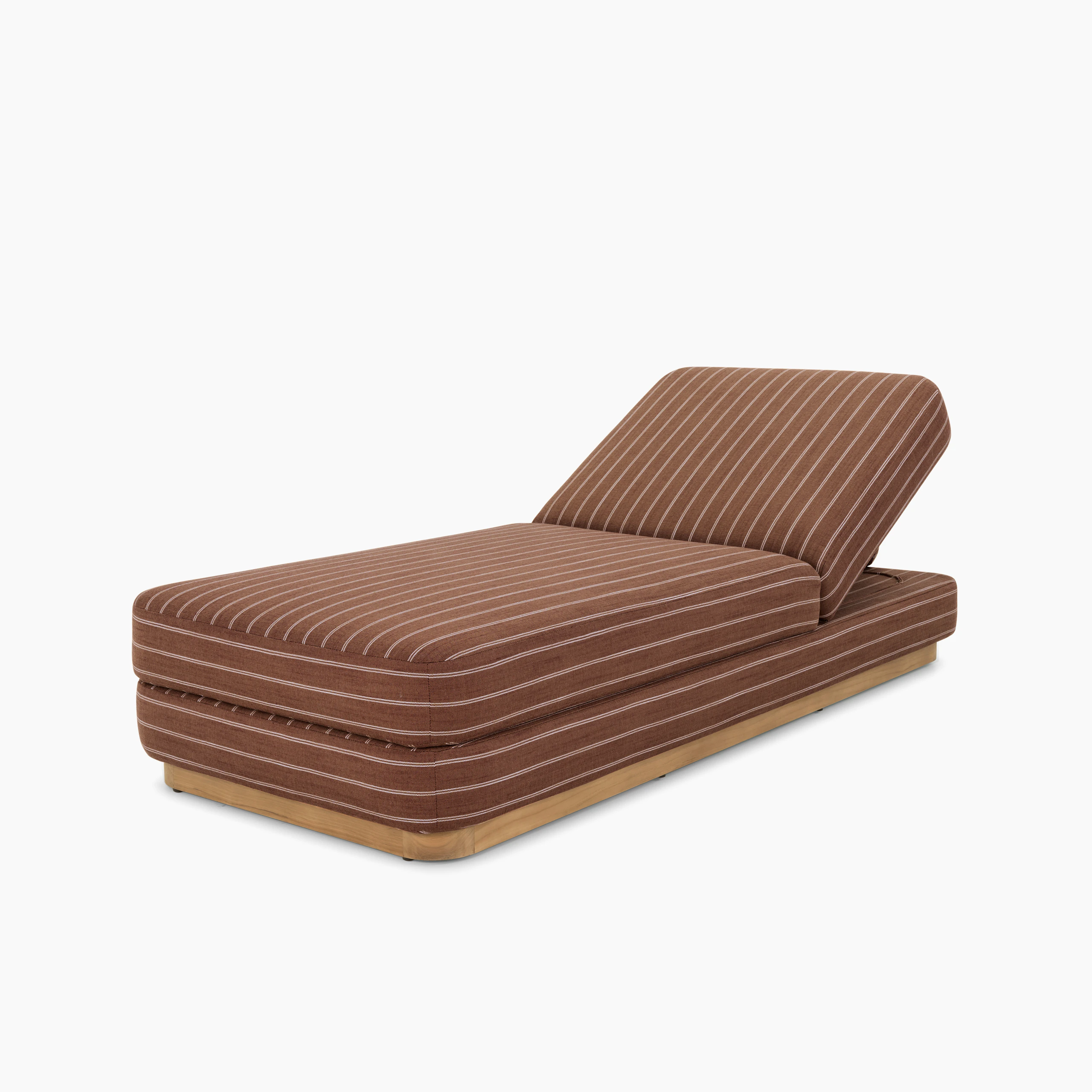A Stack Outdoor Chaise in Terra Rossa viewed from an angle.