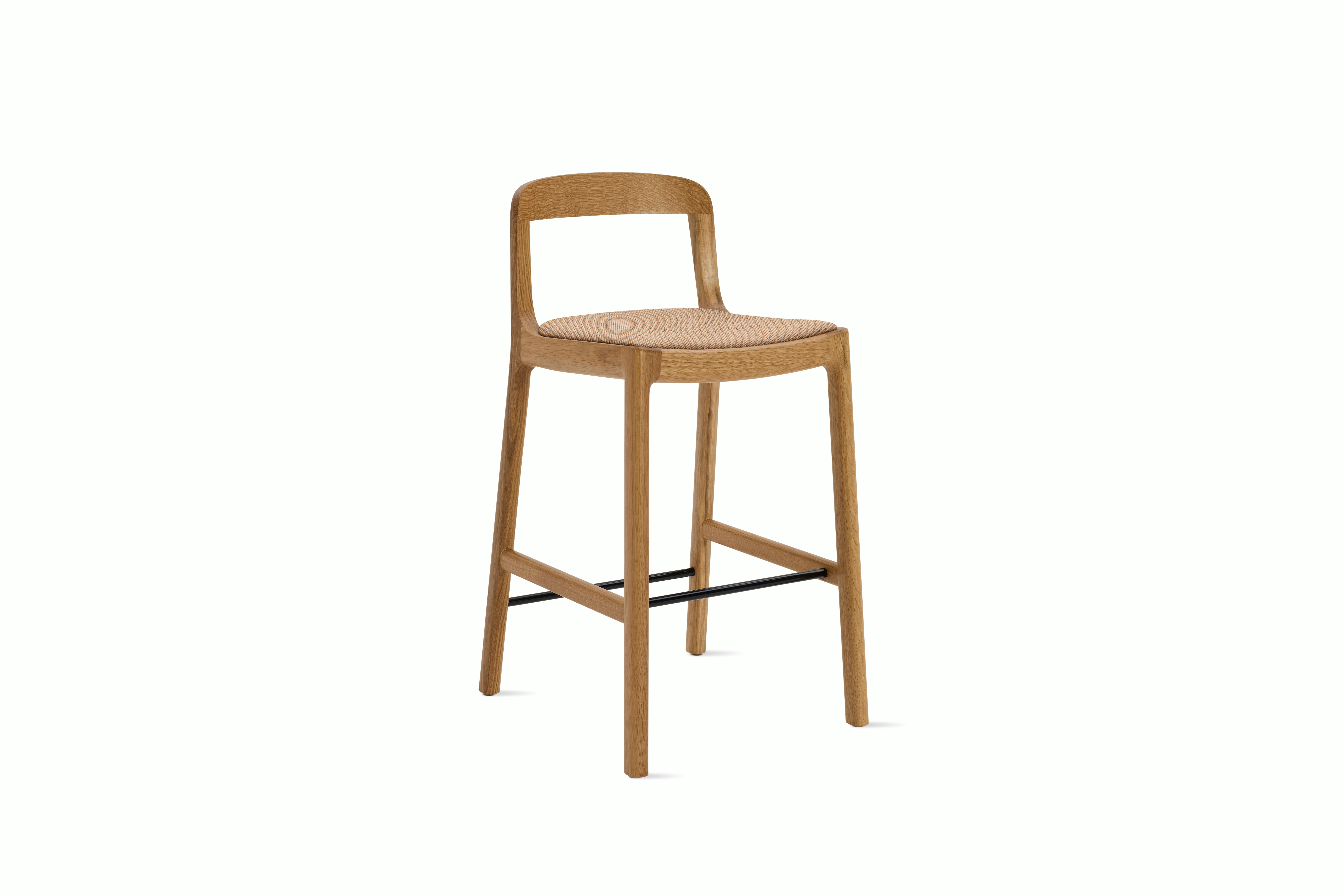 A Lijn Stool in Blush Oak viewed from an angle.