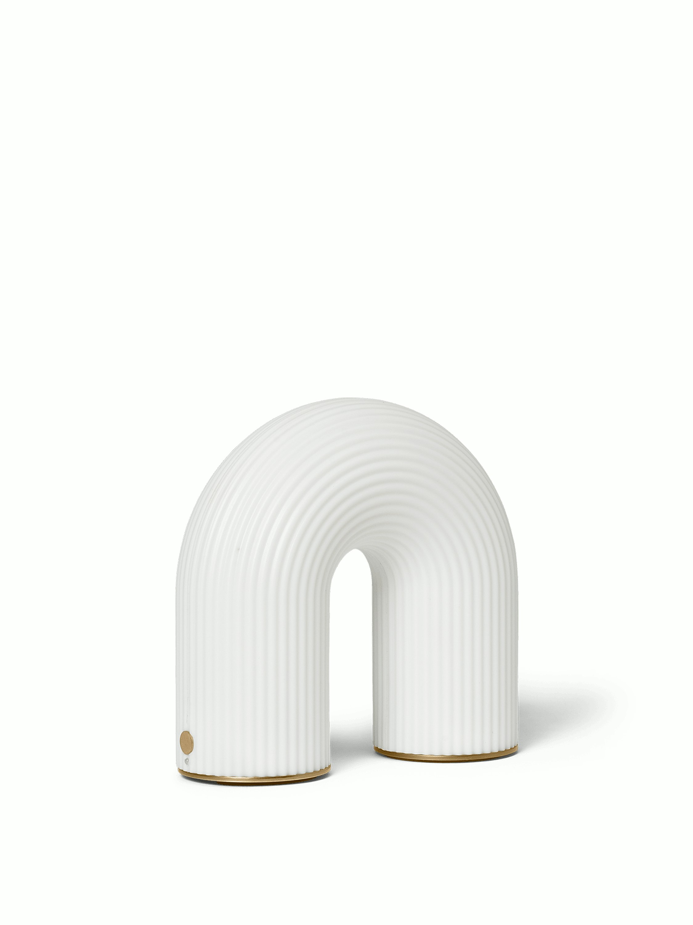 A Vuelta Portable Lamp in white Viewed from an angle.