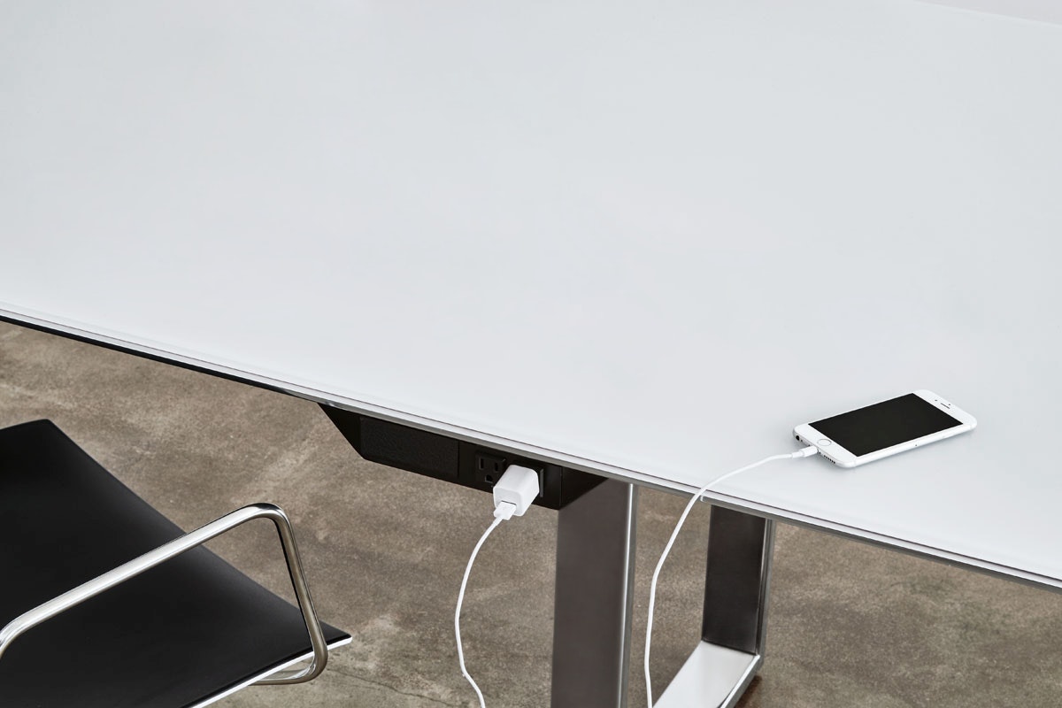 Highline Conference Table with Glass top, Polished Chrome Metal edge, detail view of undermount technology.