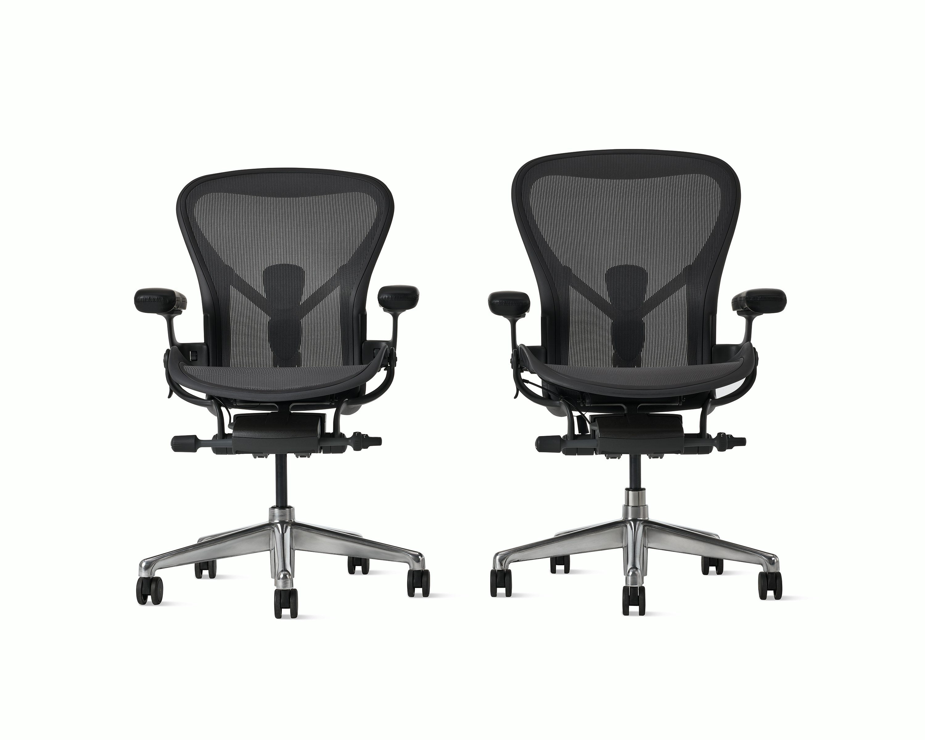 Aeron ESD size B and Aeron ESD size C chairs in graphite beside each other.