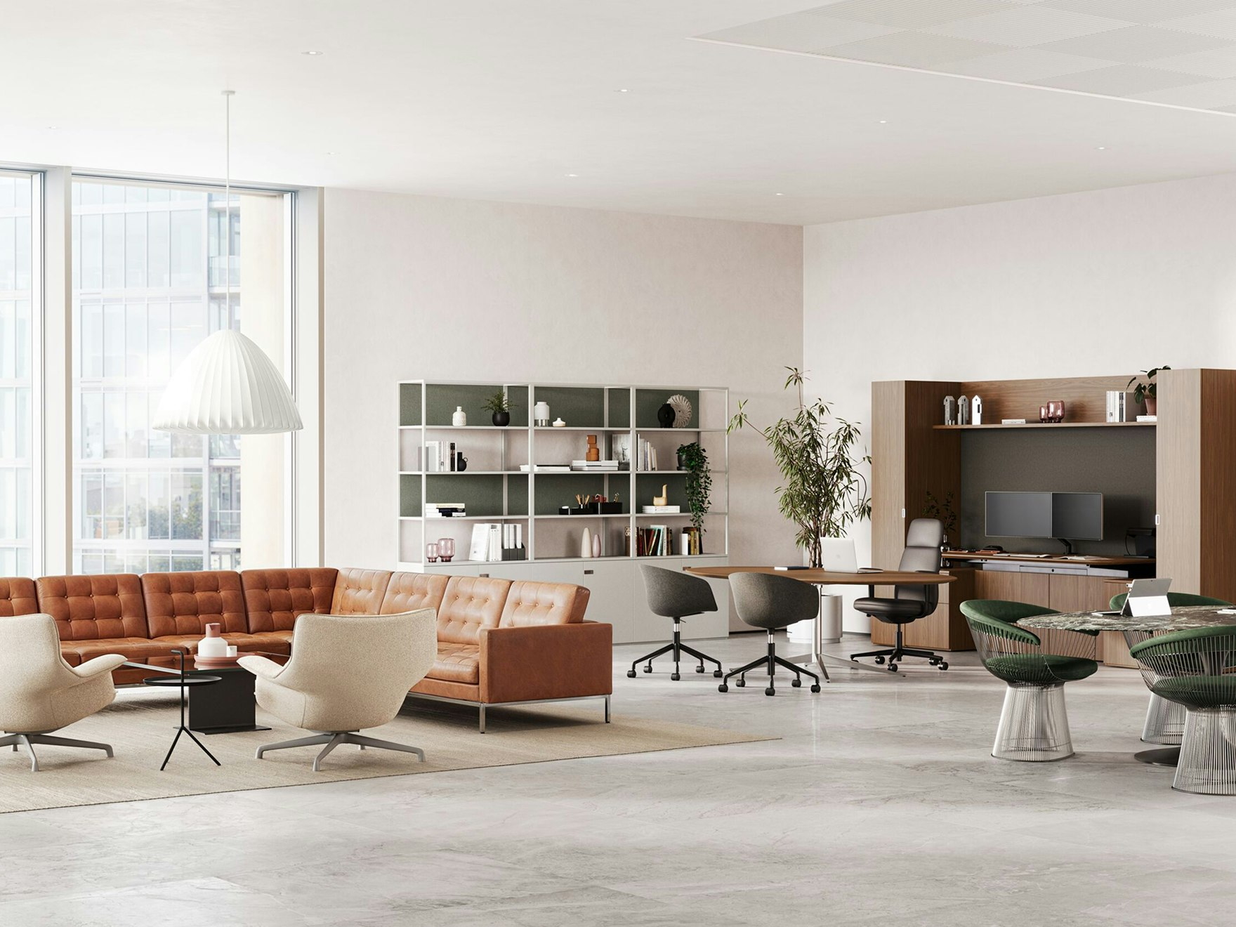 A large private office with a Knoll Konzert Collection and Asari Chair, a lounge setting with a Florence Knoll relaxed corner sofa, and a meeting setting with a Saarinen Table and Platner side chairs.