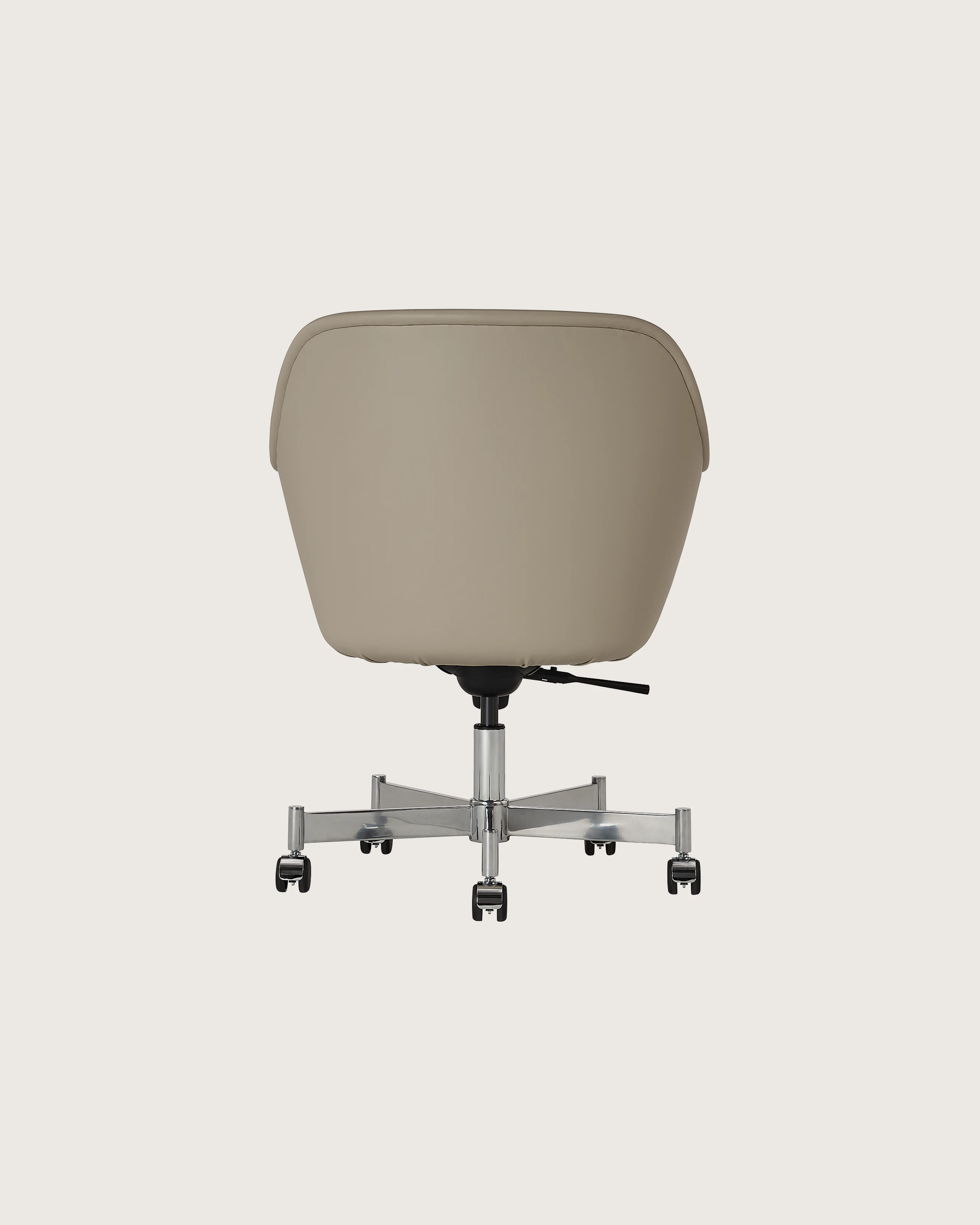 Bumper Conference Chair designed by Ward Bennett upholstered in Pace Leather in Reflection with a polished chrome base, shown back-facing on a white sweep.