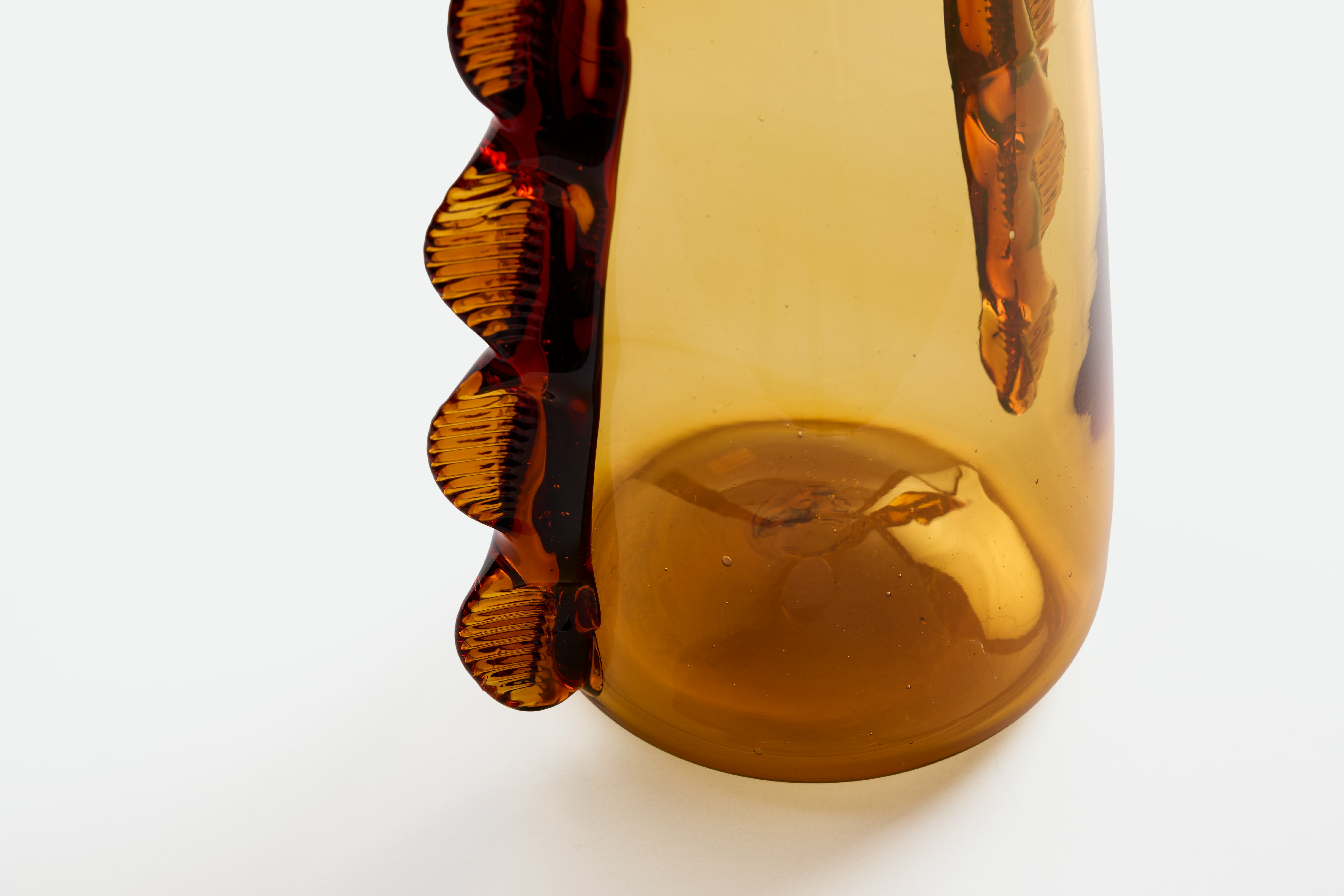 A detailed look at a Betta Vase in Amber.