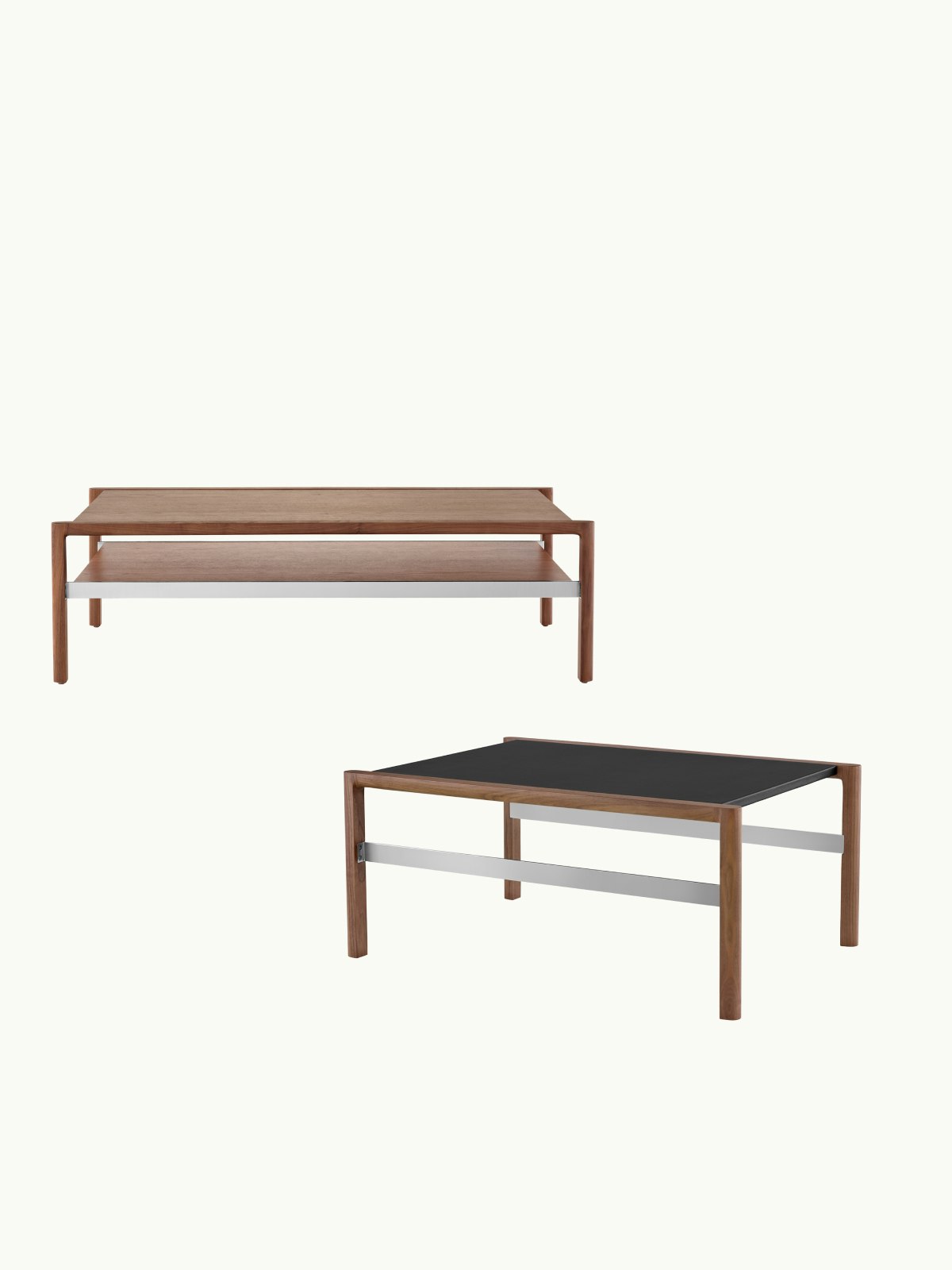 Two Brabo Tables designed by Vincent Van Duysen, one front-facing in a medium wood finish with a lower shelf, one in a medium wood finish with a black, leather-wrapped top shown at an angle and staggered below the other, on a white sweep.