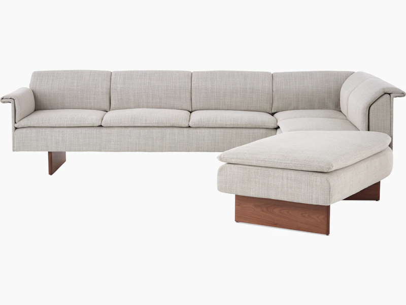 Mantle L-Shaped Sofa in Capri Stone with Walnut Wood Base.