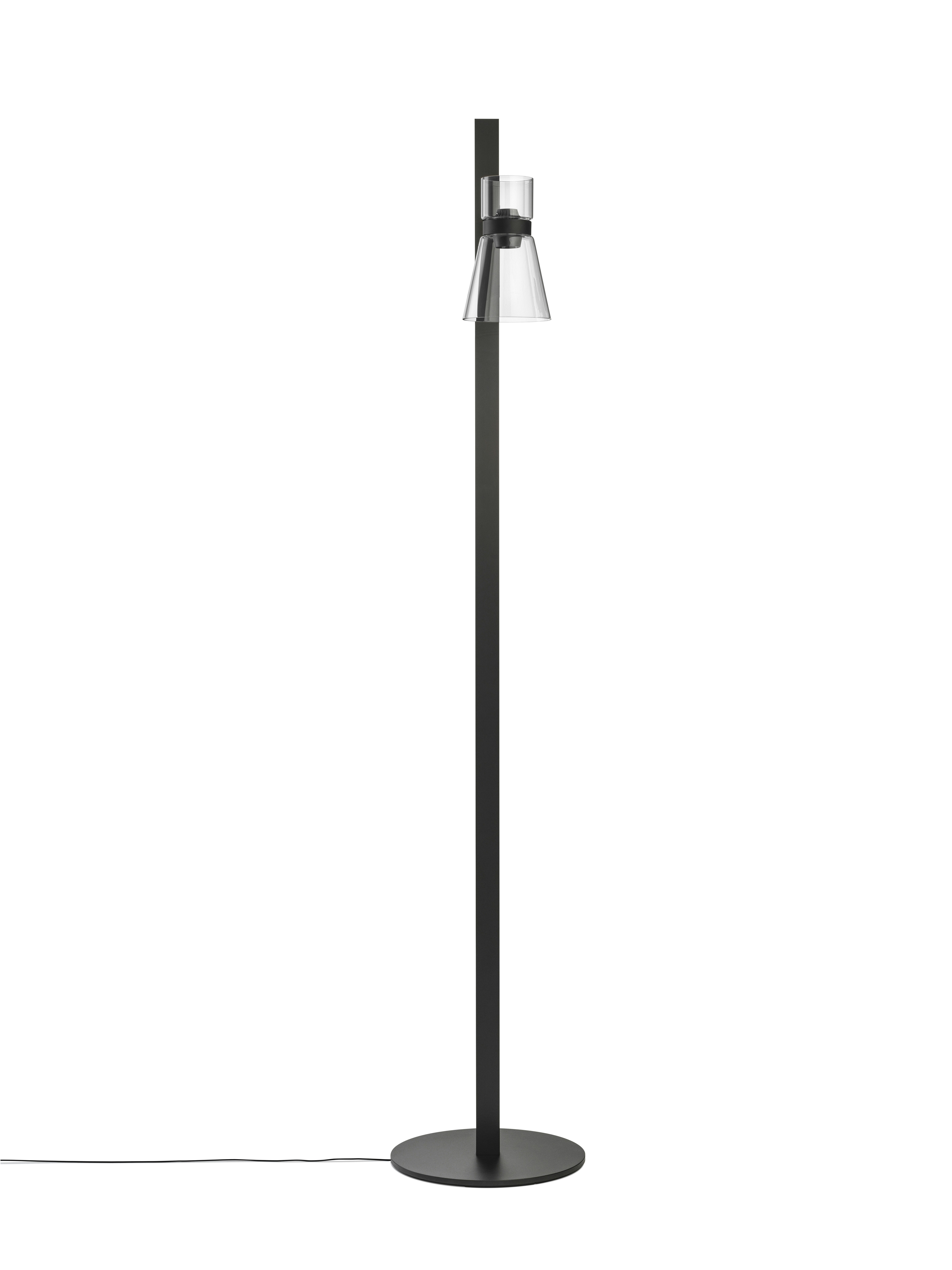 A Nocturne Floor Lamp in F1 Cone, Black viewed from behind.