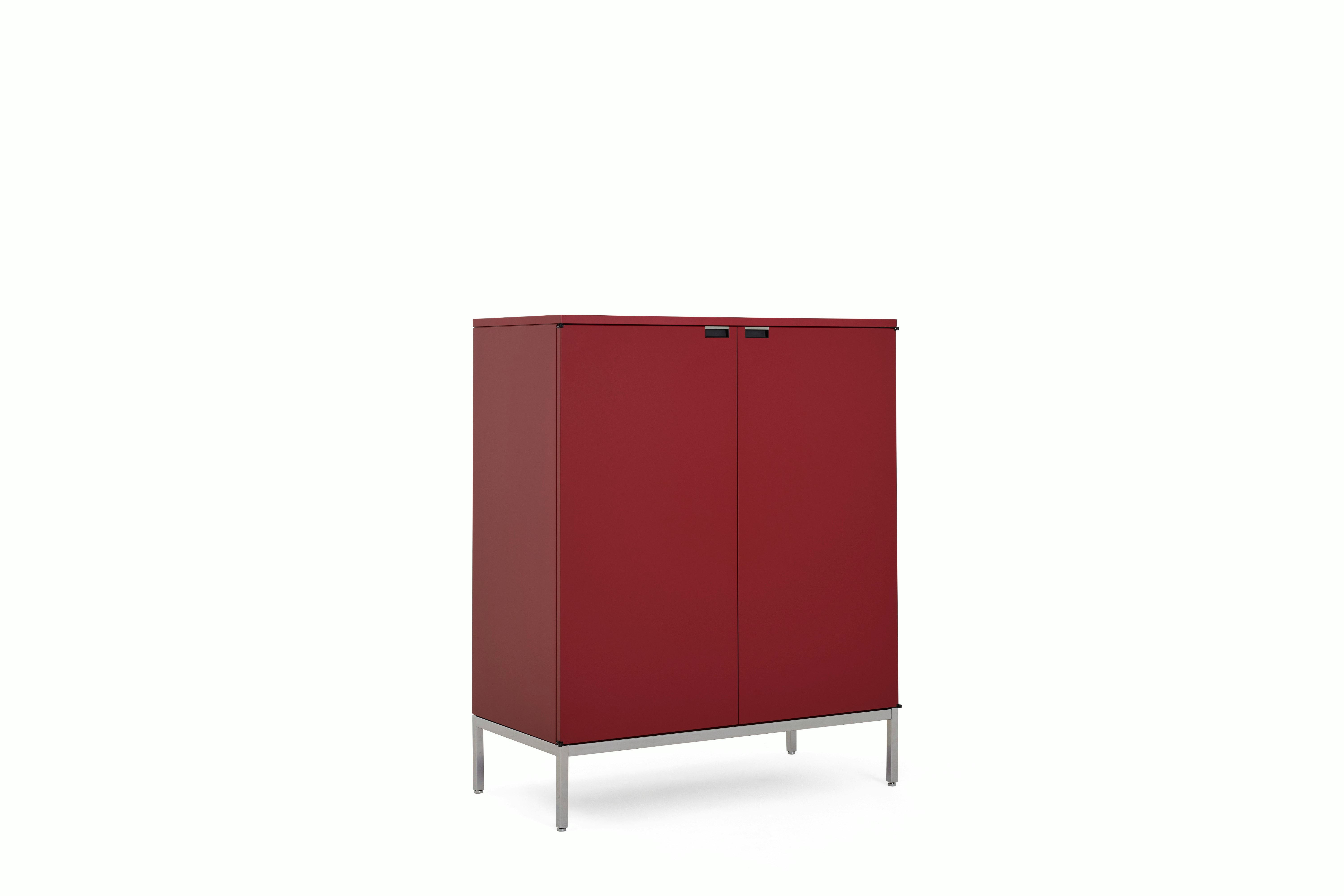 A Florence Knoll Credenza in Tall, Dark Red Lacquer, Lacquer, Dark Red Lacquer viewed from an angle.
