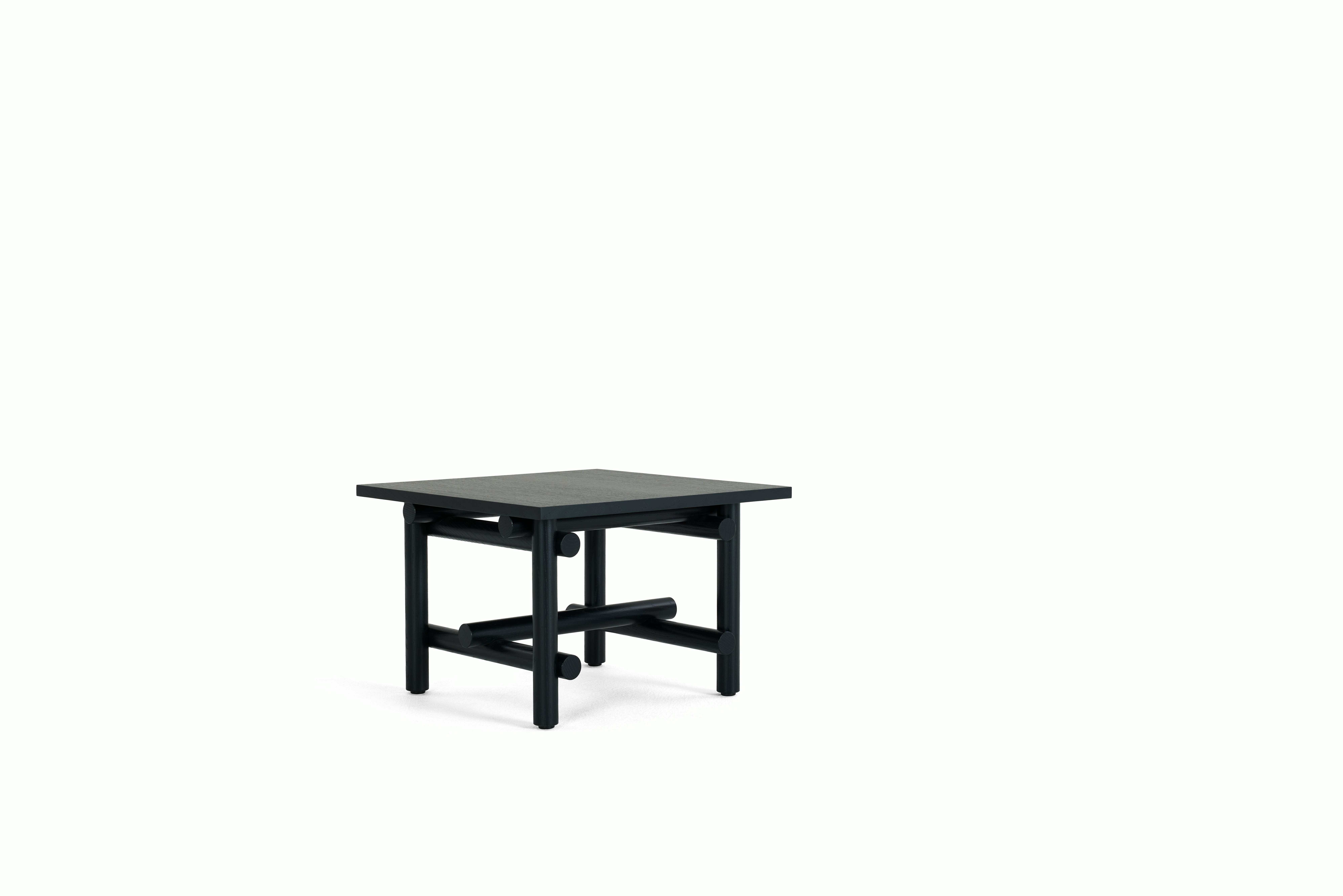 A Muecke Side Table in Ebonized Ash viewed from an angle.