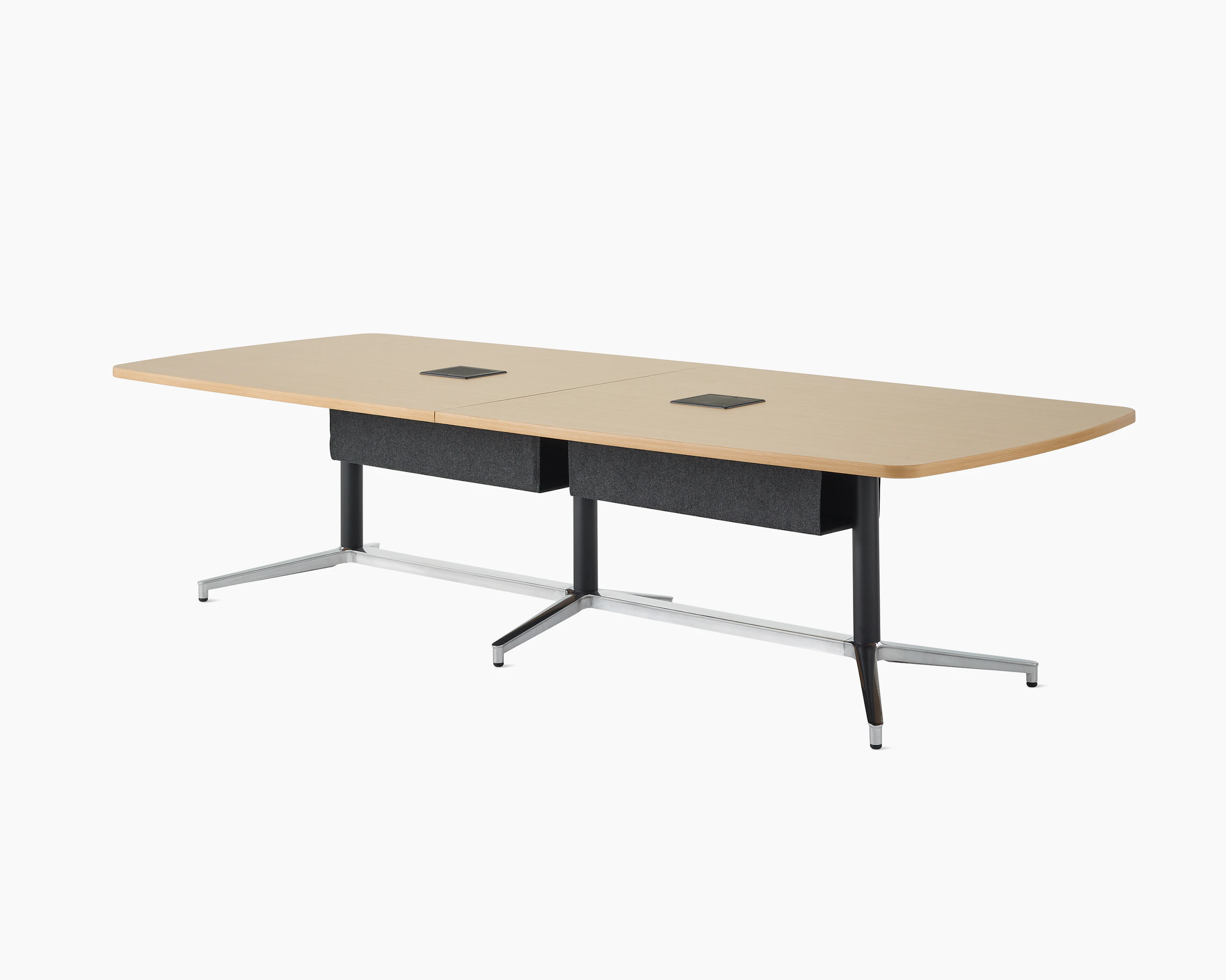A large boat shape Y base Headway conference table with a medium wood top, black fabric tech hammock, and black base viewed at a 45-degree angle.