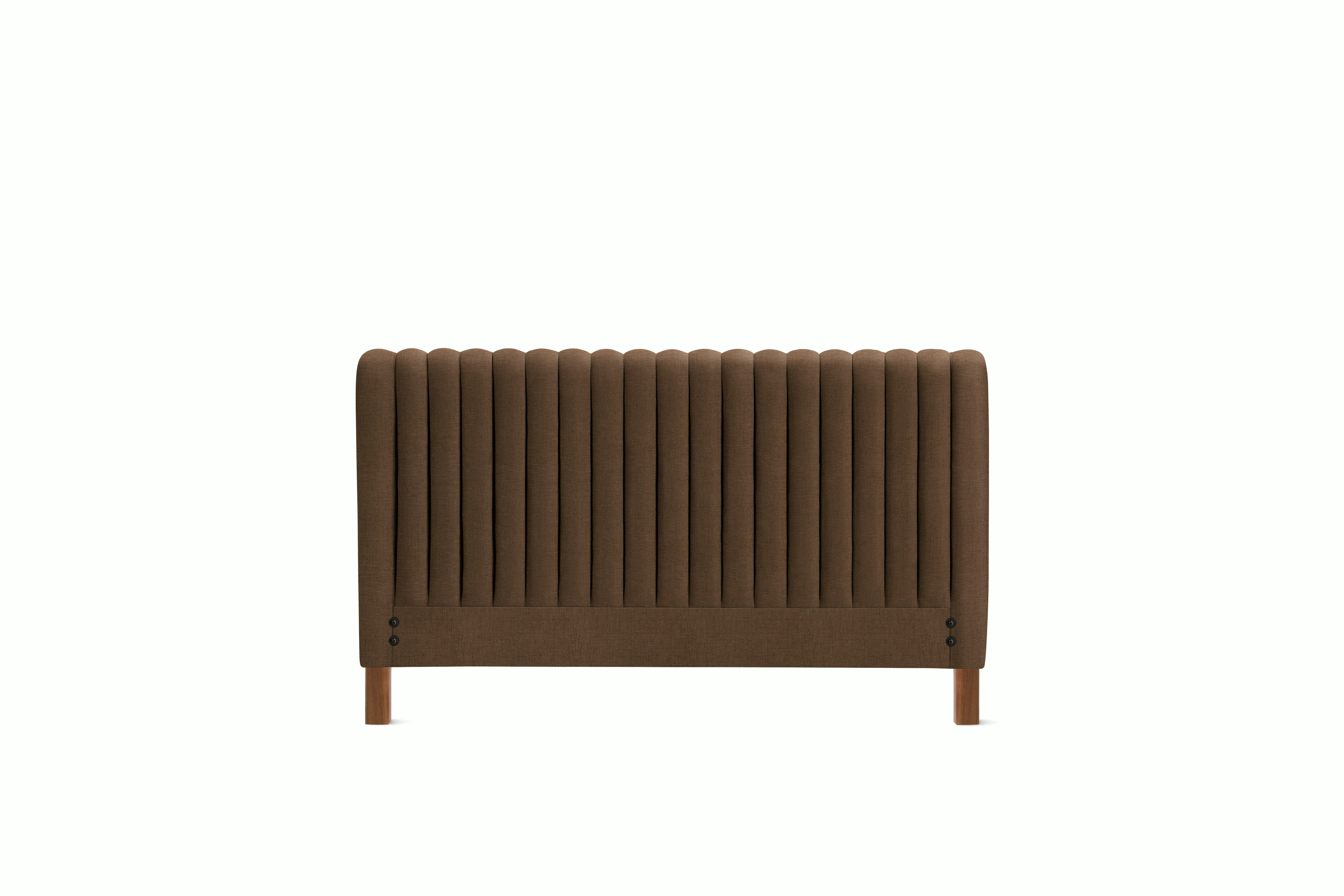A Charlotte Headboard in Walnut viewed from an angle.