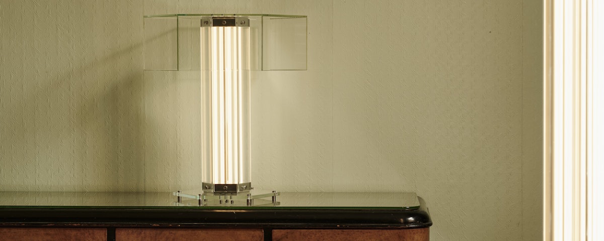SuperWire Table Lamp on an antique dresser