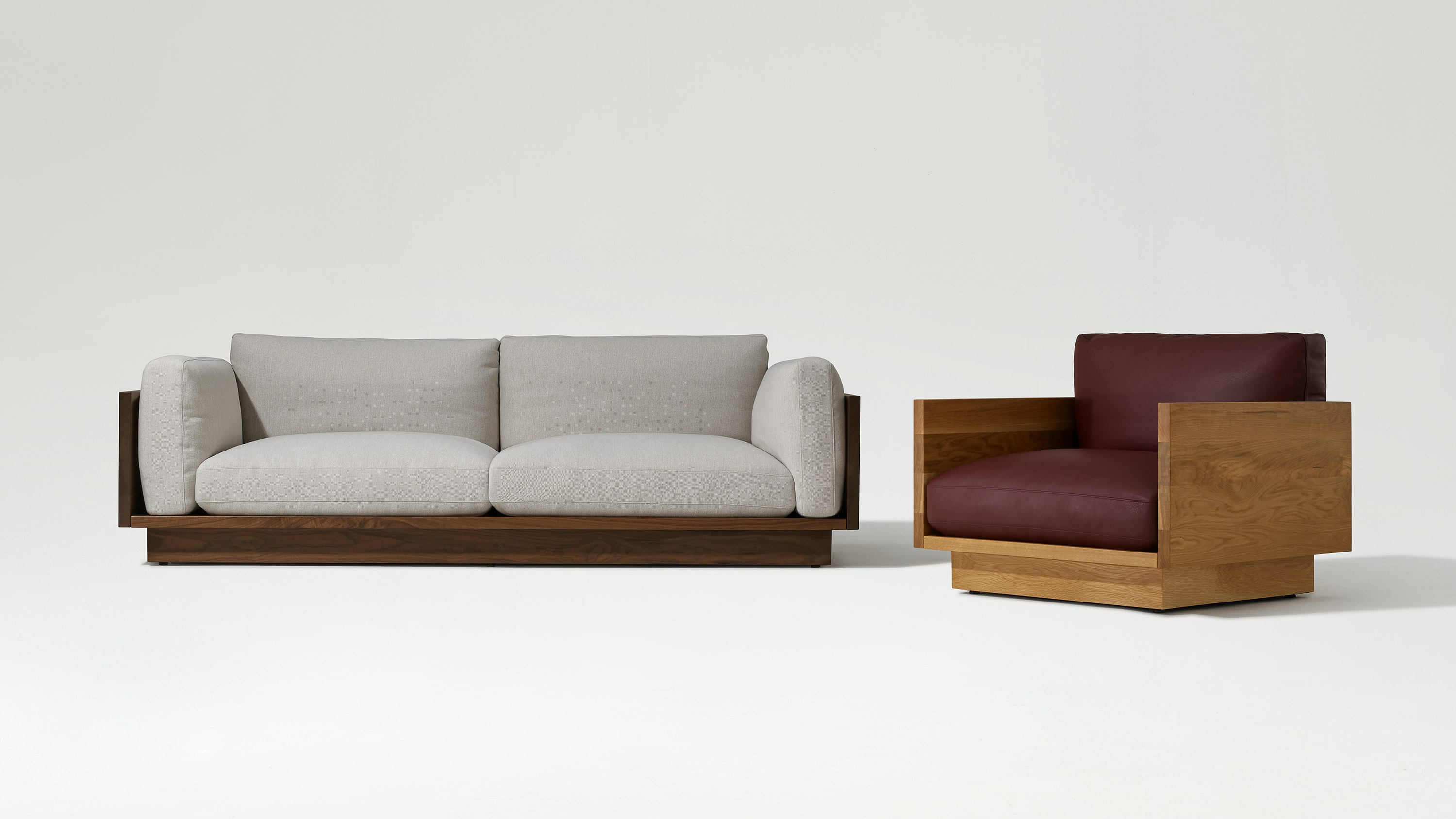 Pawson Drift Sofa, 93" in walnut and grey cushions (Mode Clavicle) and lounge chair in oak and maroon leather (Prone Mantra)
