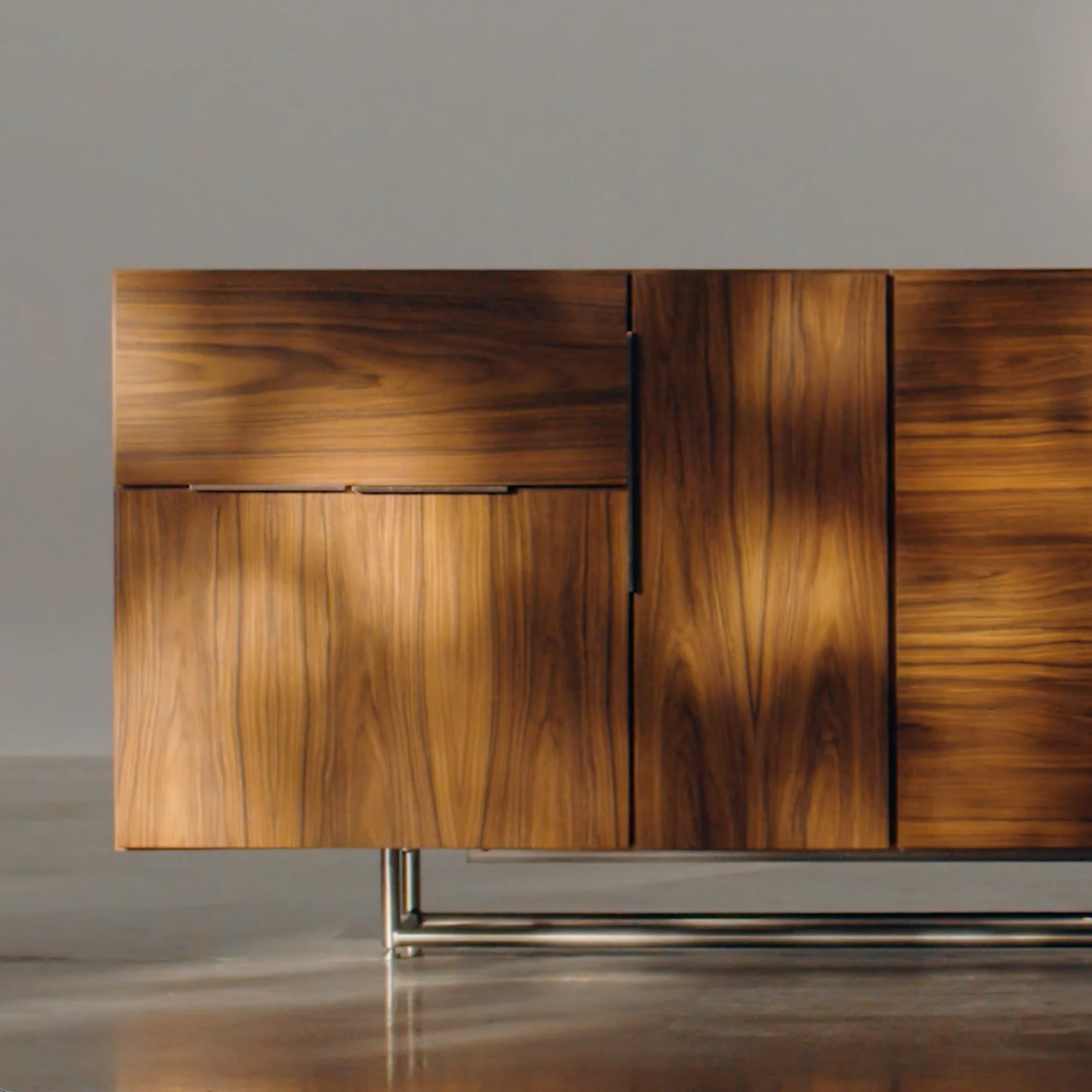 Domino Credenza in Natural Walnut in a studio setting, viewed from the front.