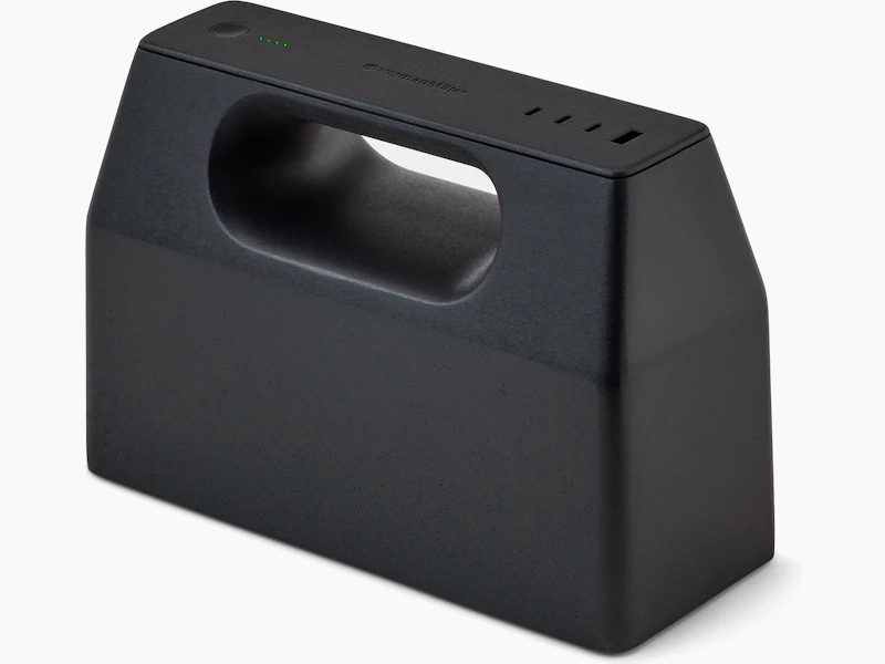 Black OE1 Power Pack viewed from an angle with four green charge indicator lights illuminated.