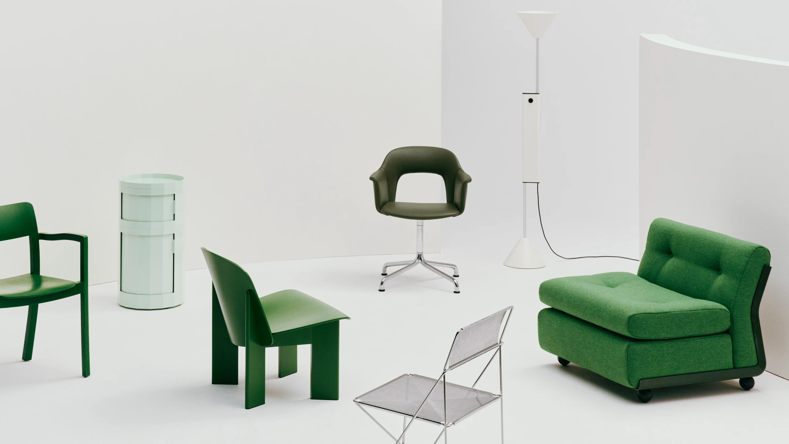 Green HAY products including Chisel Lounge Chair, Amanta Sofa, Facet Cabinet, Layout Armchair, and X-Line Chair arranged on a white backdrop.