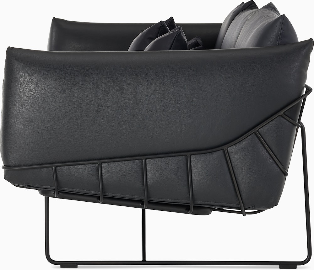 Wireframe Sofa three seater with black leather cushions and black frame.