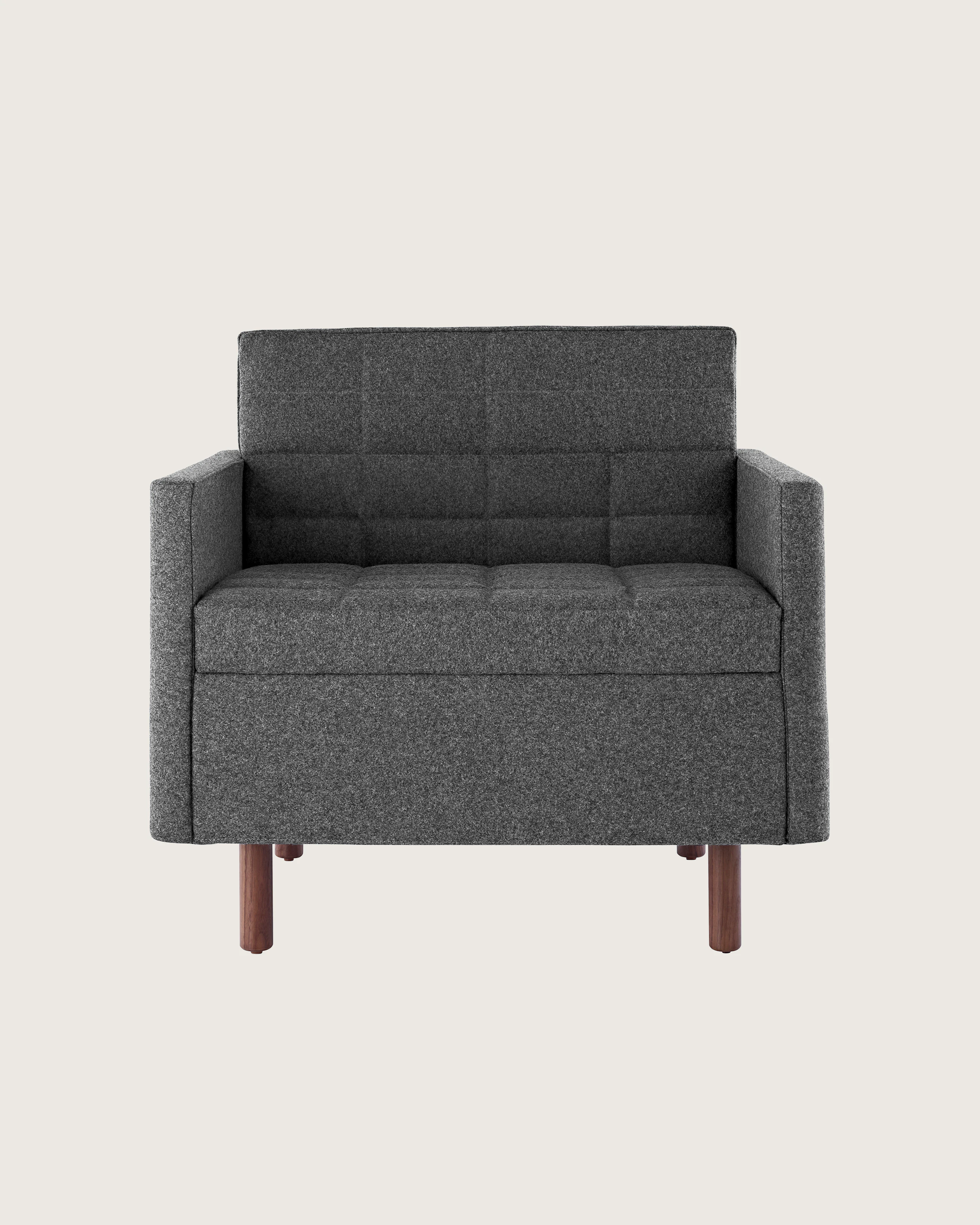 Front view of the seat and back of a dark gray Tuxedo Classic club chair, showing the quilted upholstery.