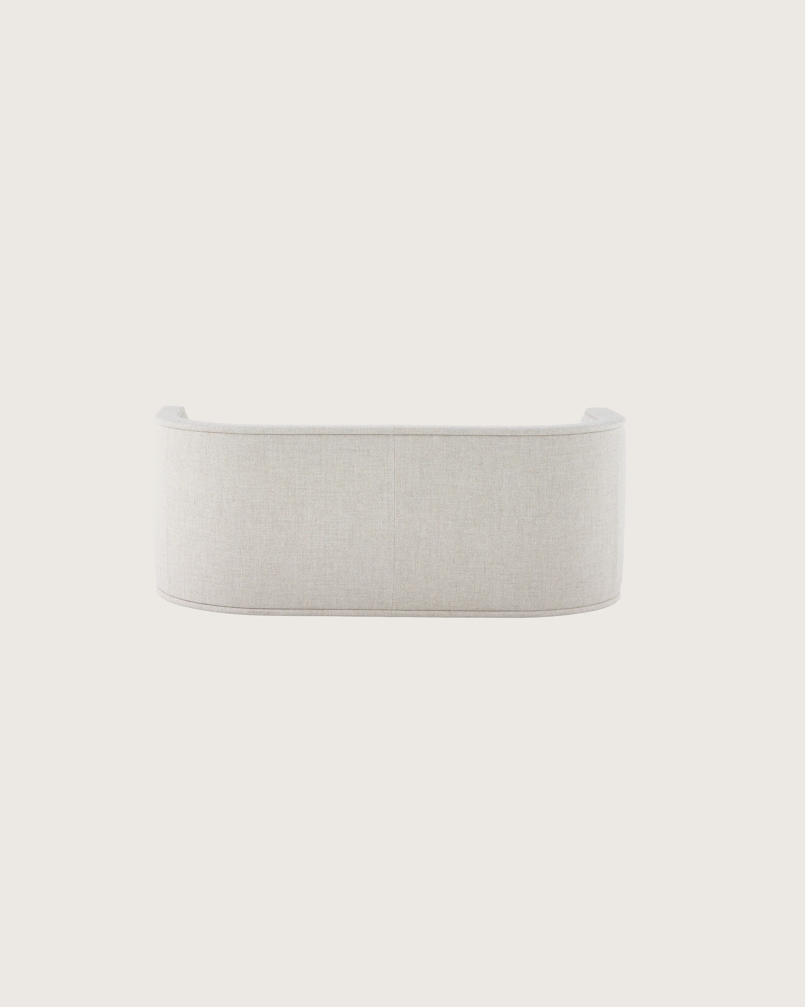 A U-Series Settee upholstered in a light neutral fabric.