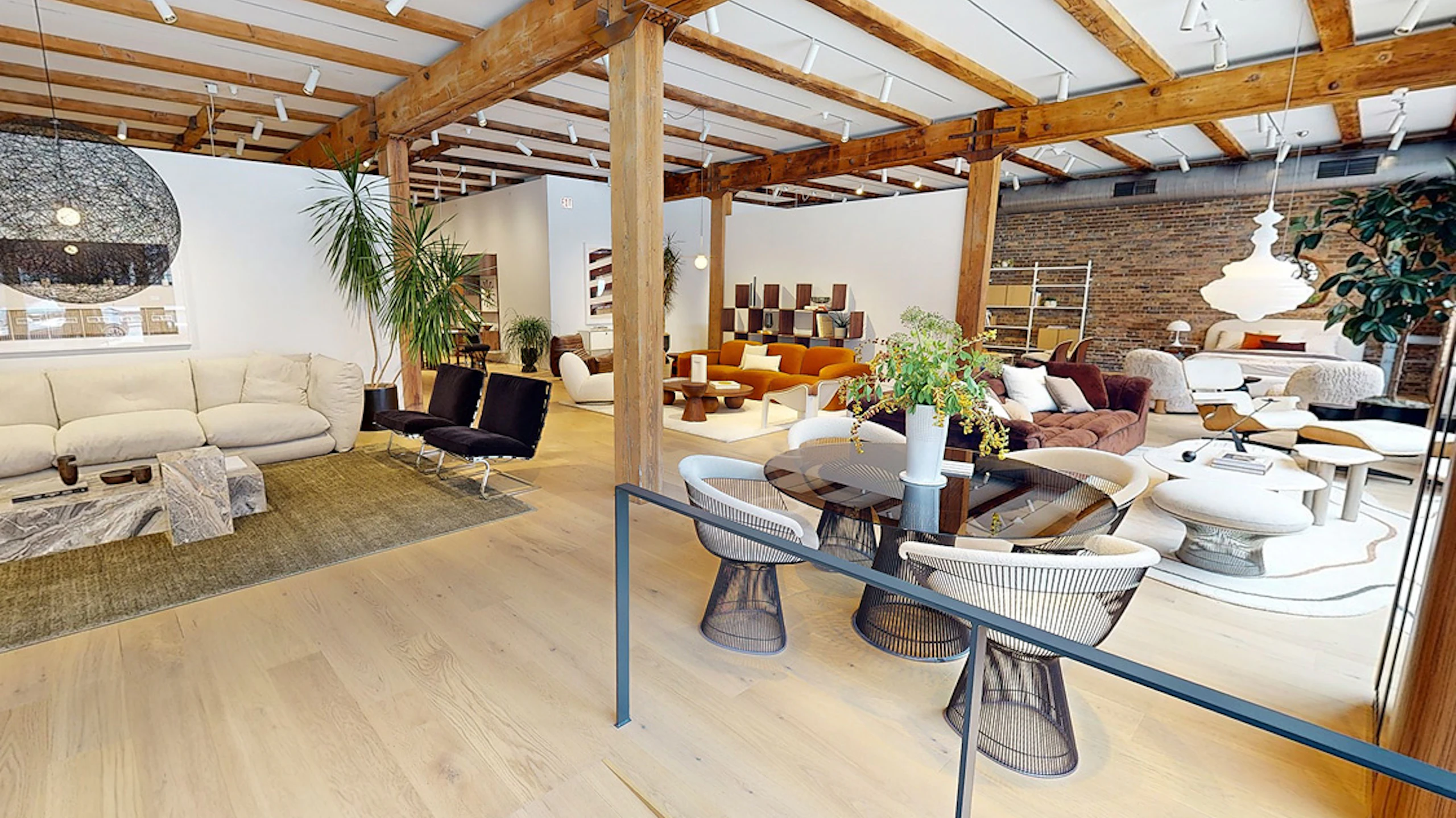 A MillerKnoll showroom at 1144 West Fulton Market during Design Days 2025. A wide arrangement of furniture from NaughtOne, HAY, DWR, and Muuto can be seen throughout the display.
