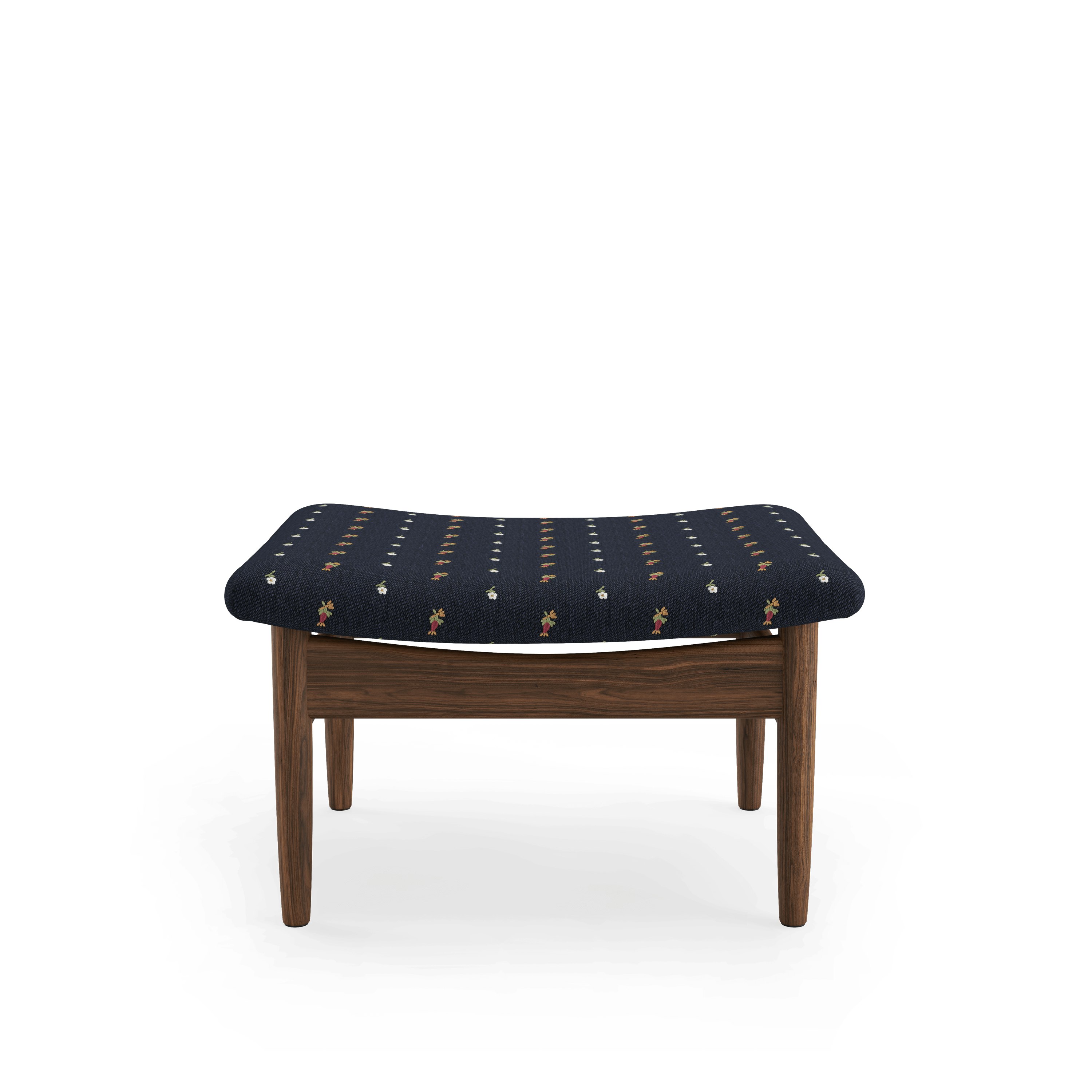 A Japan Footstool in Walnut viewed from the front.
