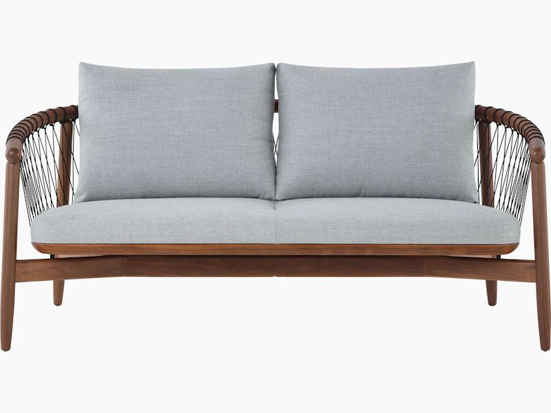 A Crosshatch Settee with a walnut frame, black cords, and light neutral fabric, viewed from the front.