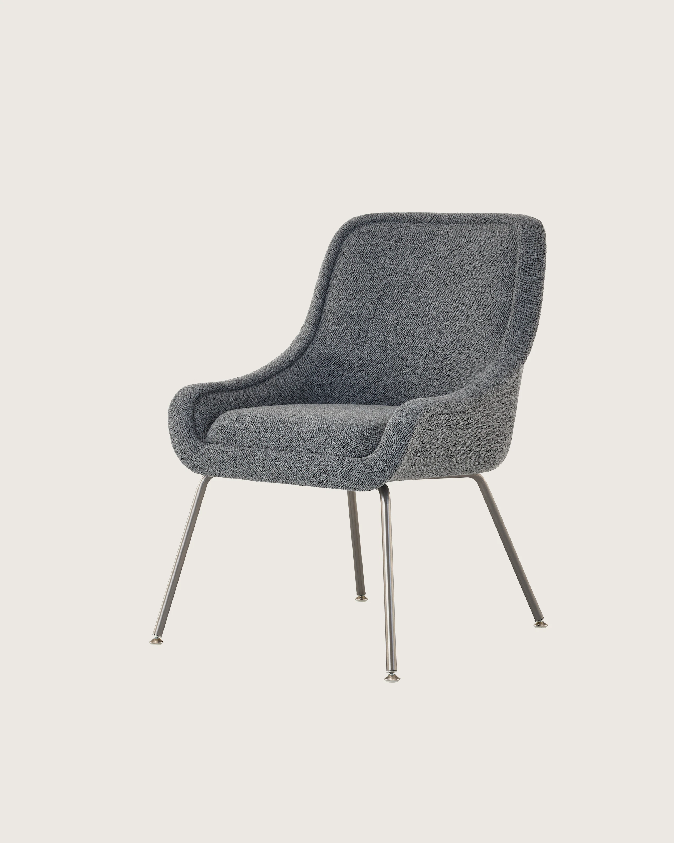 Bumper Armchair with low arms and four legged base.