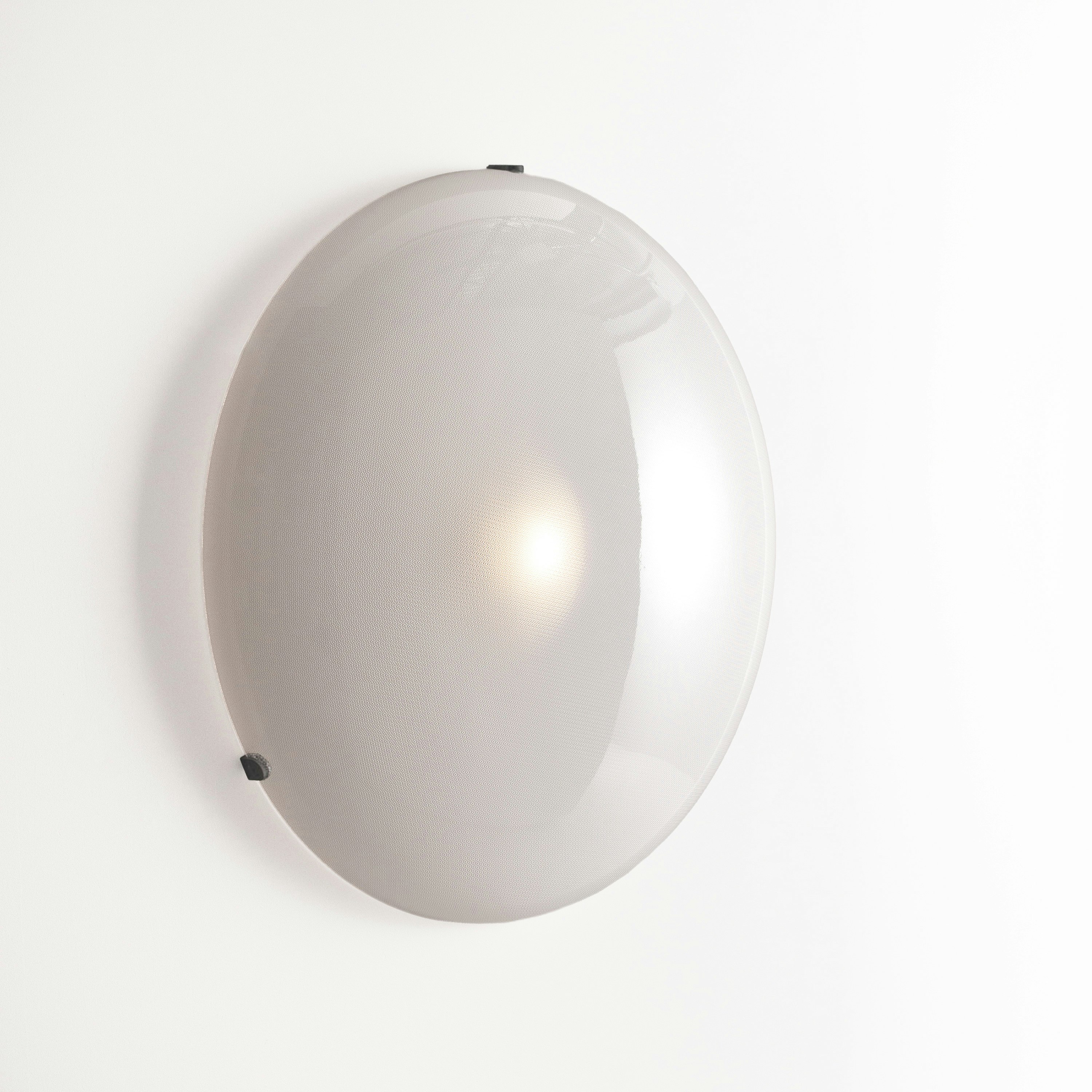 A Iris Wall / Flush Mount in Black viewed from an angle.