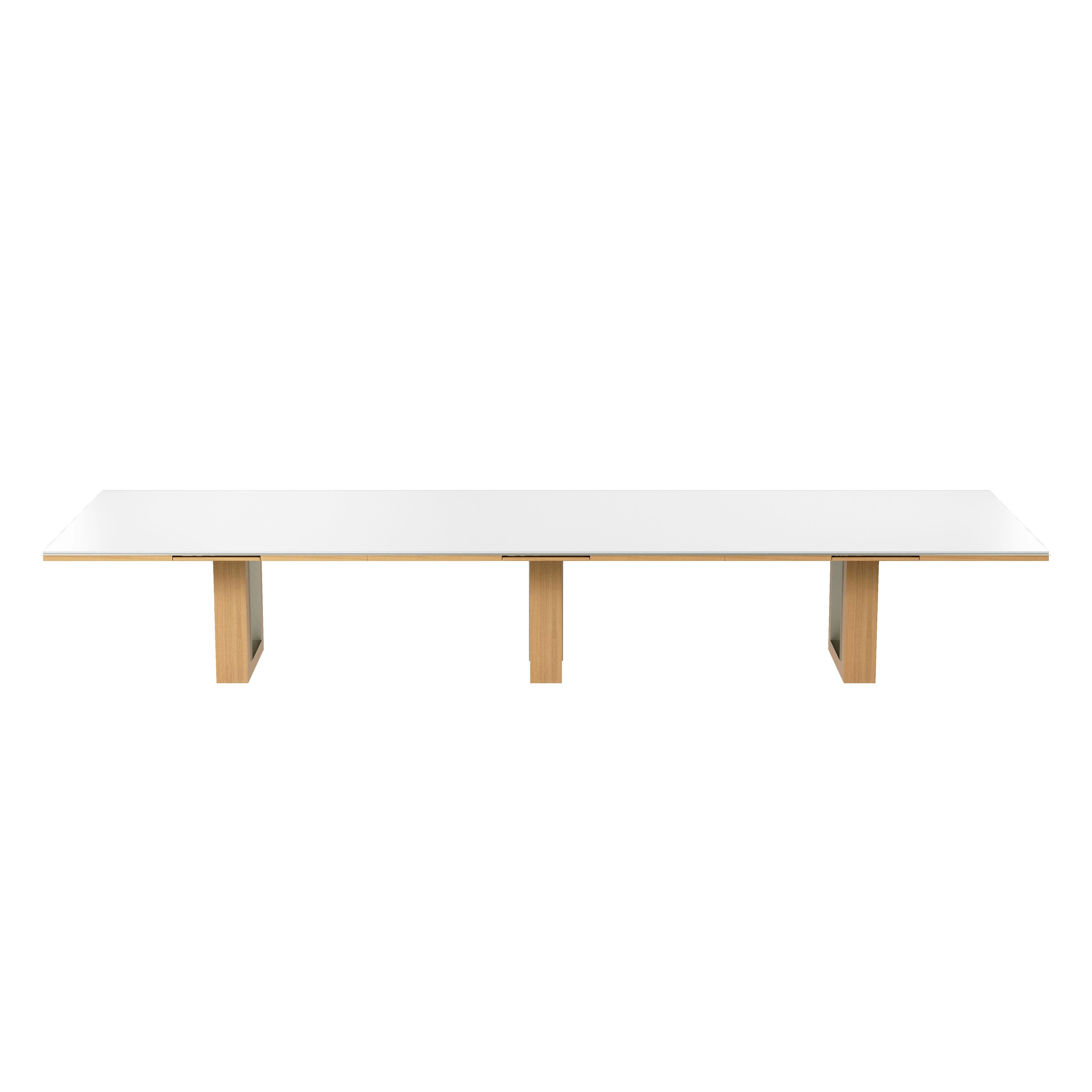 Rectangular Highline Fifty Conference Table in Glacier White Corian and Natural Rift Cut Oak with a Satin Nickel edge and base trim viewed from the front.