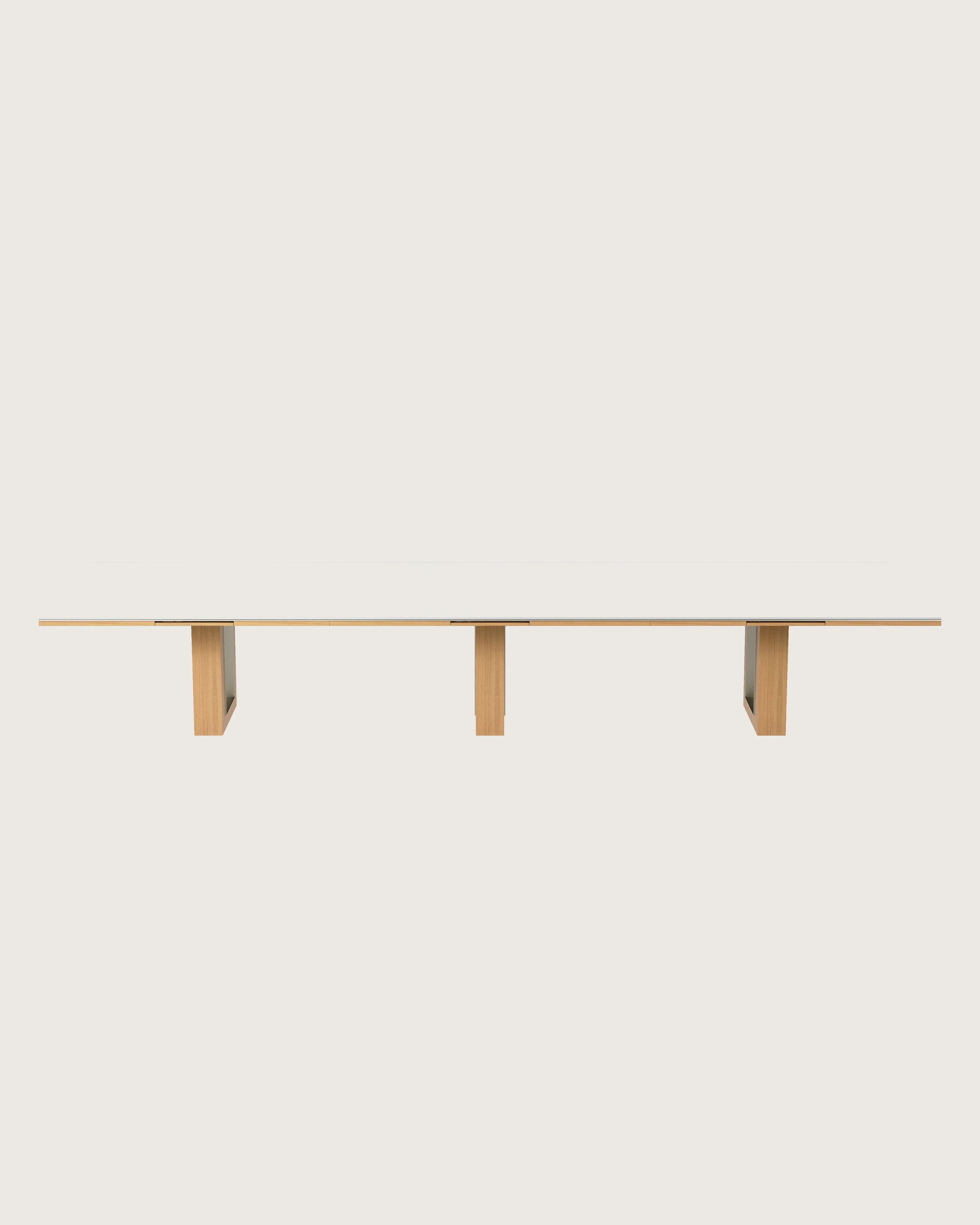 Rectangular Highline Fifty Conference Table in Glacier White Corian and Natural Rift Cut Oak with a Satin Nickel edge and base trim viewed from the front.