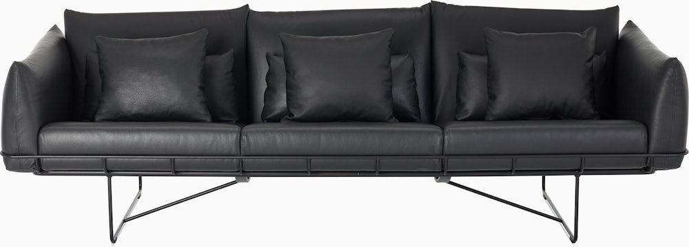 Wireframe Sofa three seater with black leather cushions and black frame.