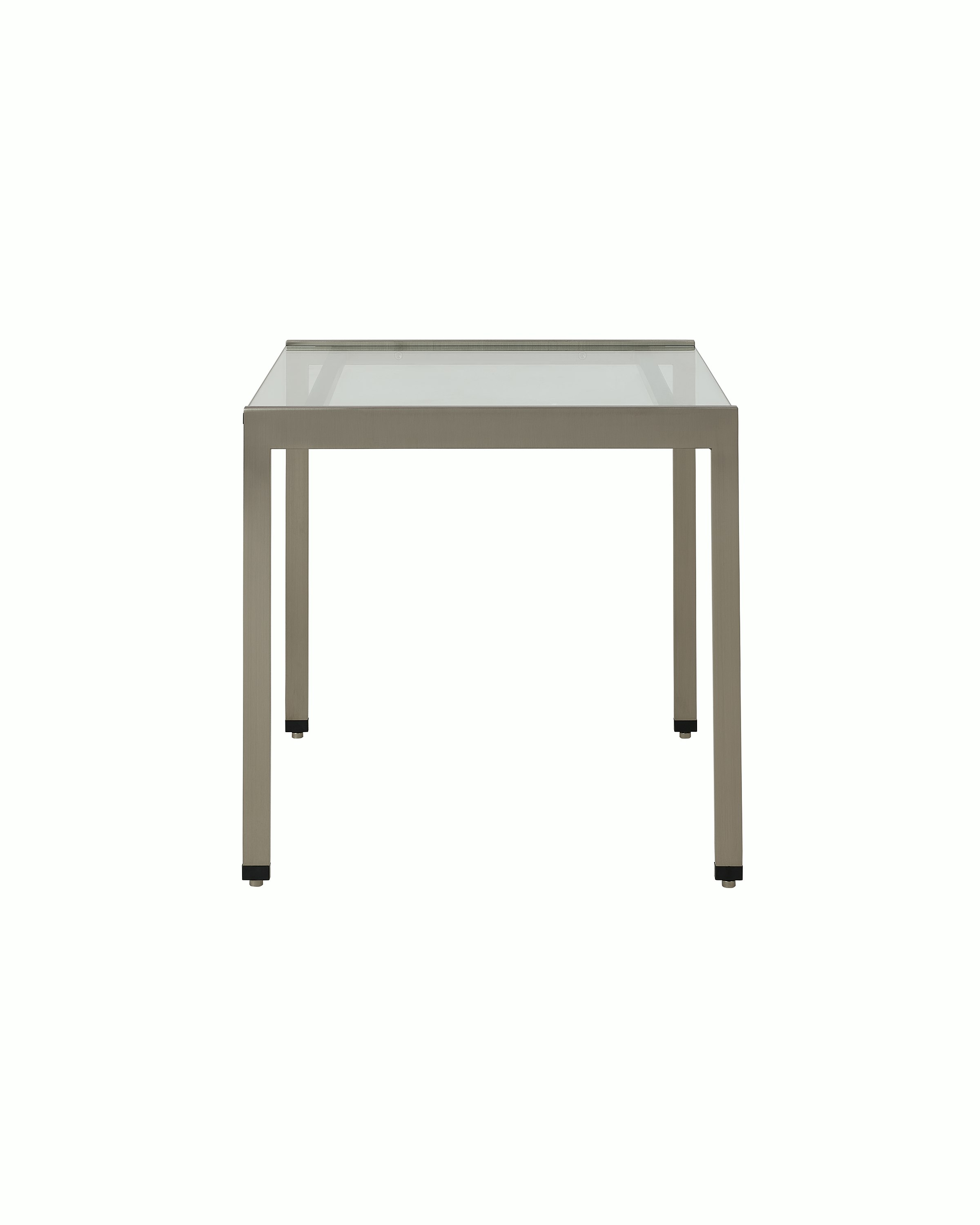 H Frame Side Table designed by Ward Bennett with a satin chrome base and a clear glass top, shown front-facing on a white sweep.