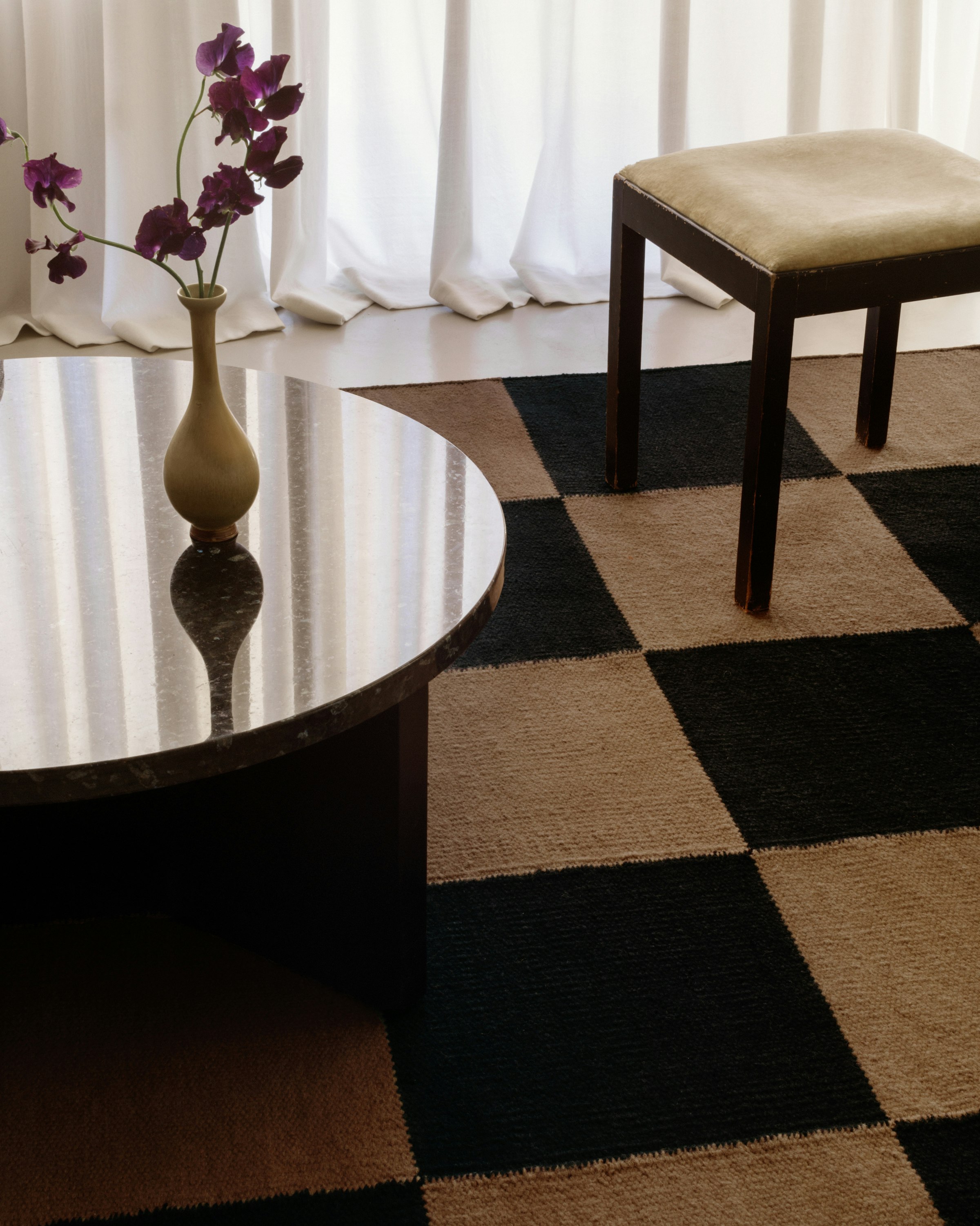 Square Flatweave Rug on a living room floor