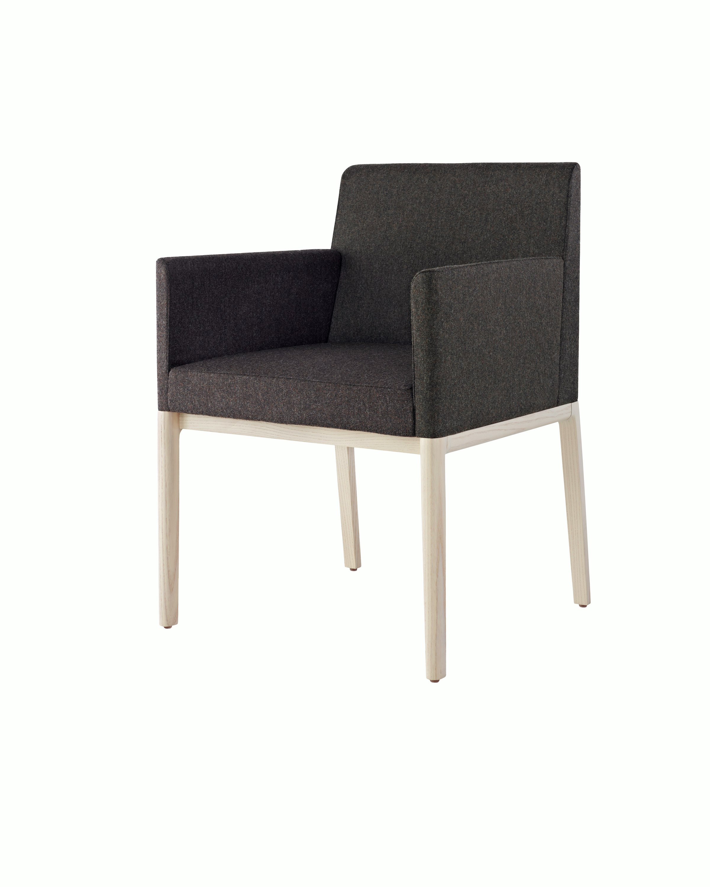 Angled view of a Nessel side chair with wraparound arms, showing the precision upholstery and wood craftsmanship.