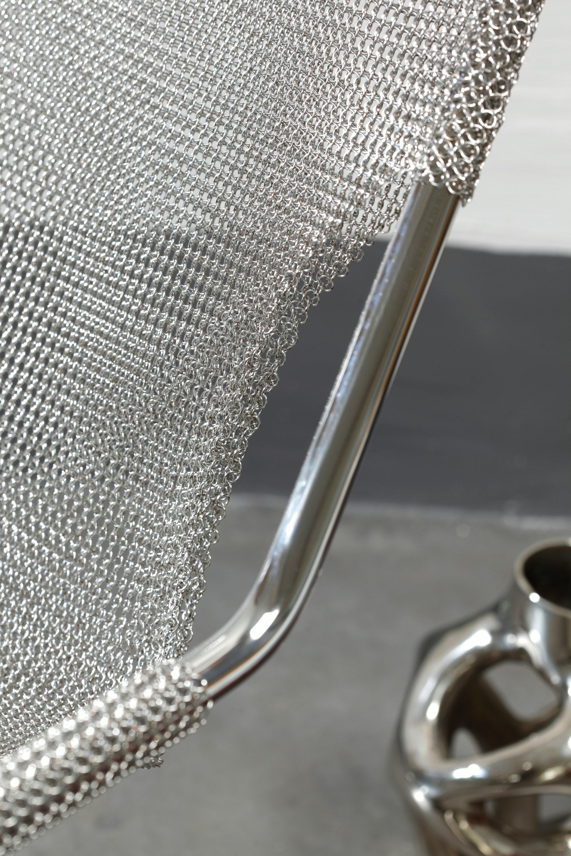 Environmental shot of Paulistano Armchair in Silver Mesh, Stainless Steel.