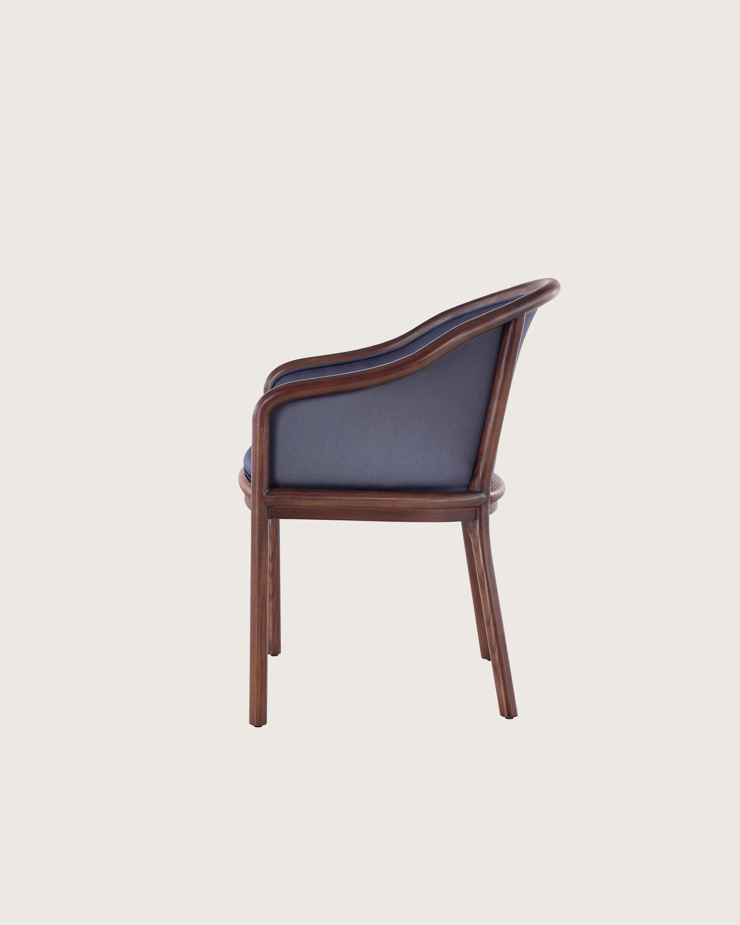 Side view of a Landmark side chair with dark blue French upholstery, a dark wood frame, and standard-height arms.